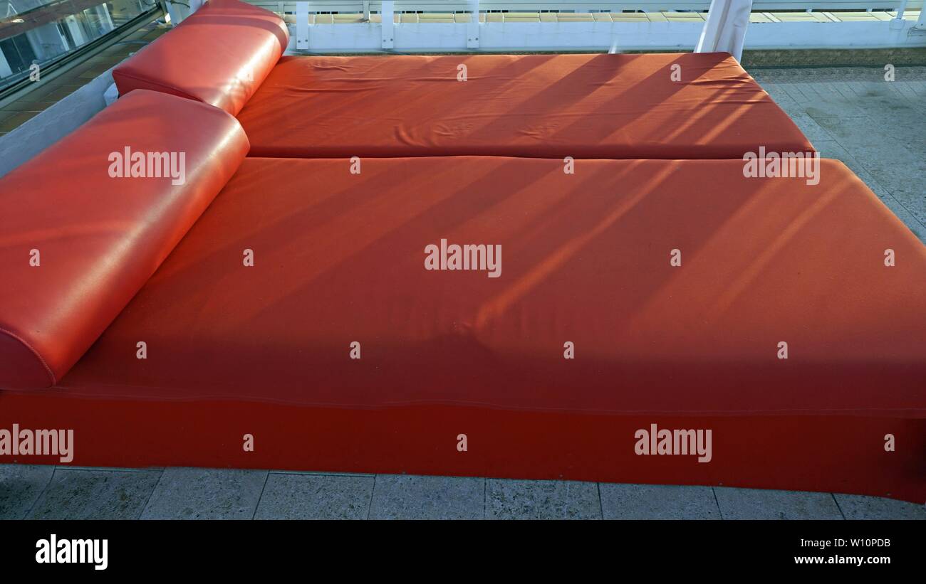 luxury red sunbed on a rooftop bar in spain Stock Photo Alamy