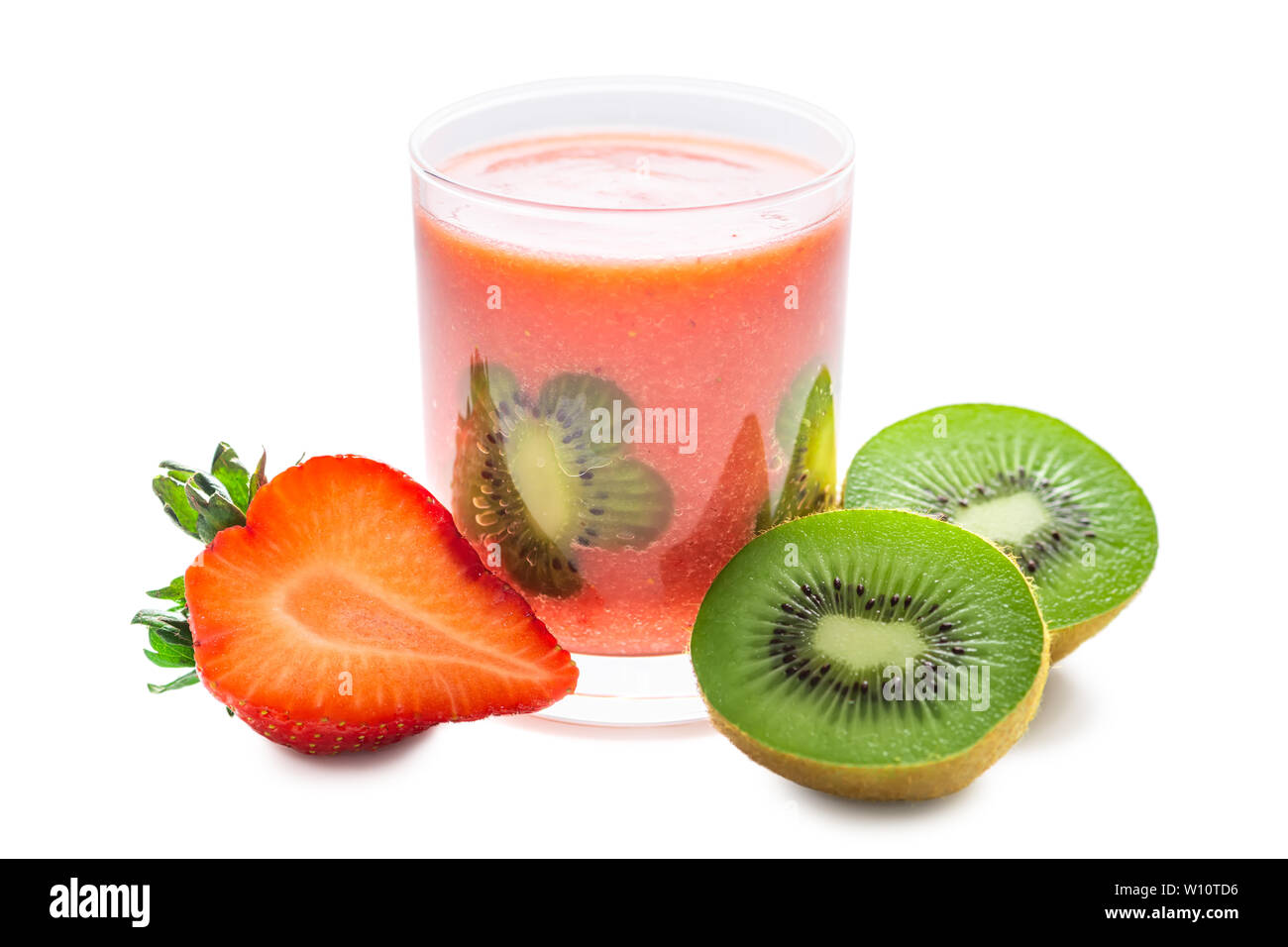 blended strawberry juice in transparent glass decorated kiwi and