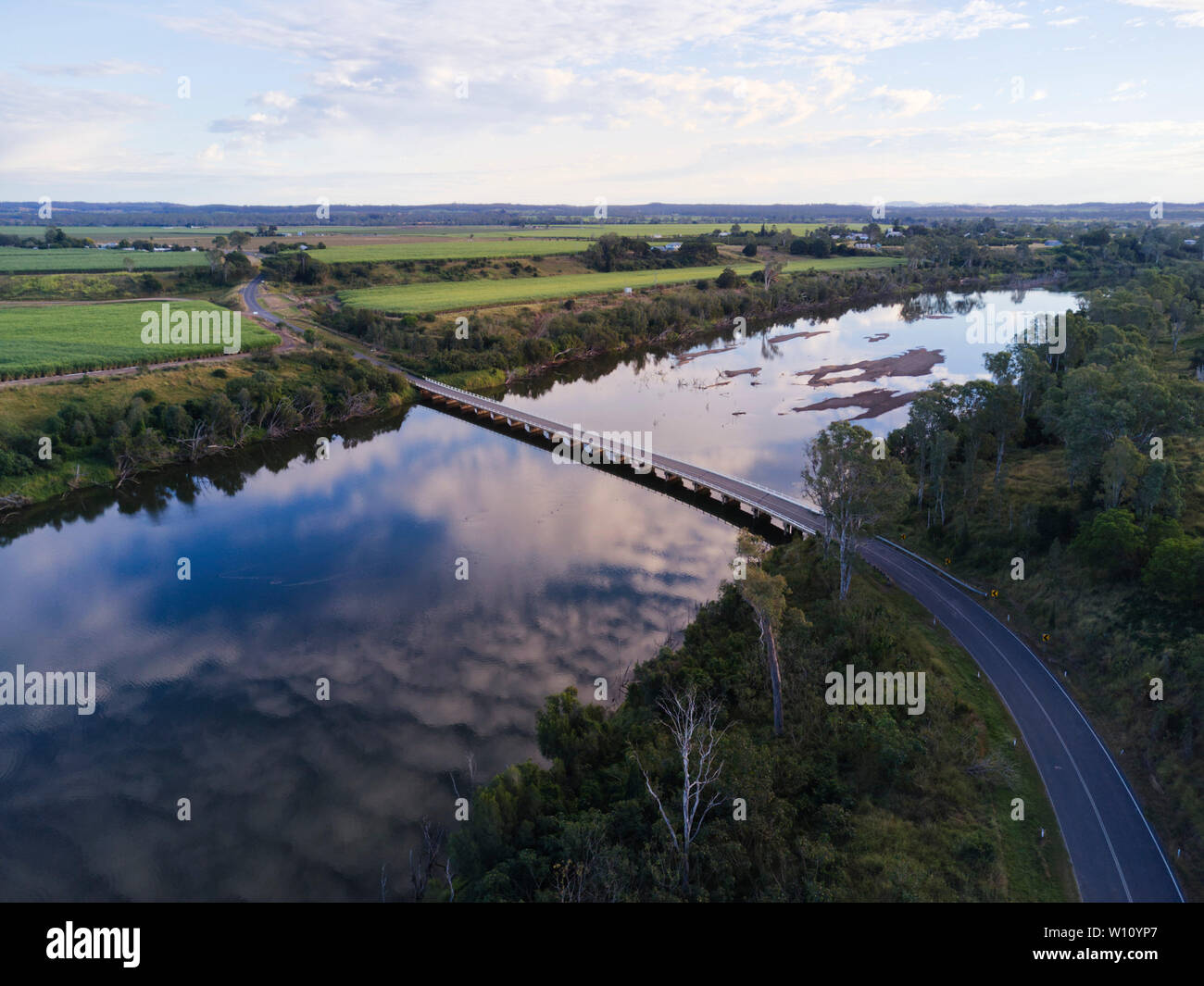 Aerial of the former Bruce Highway traffic bridge as it crosses the Burnett River at Wallaville Queensland Australia Stock Photo