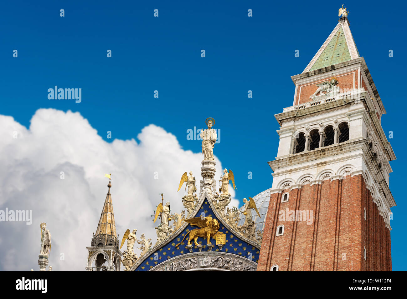 Detail of the bell tower (Campanile di San Marco) and the cathedral (Cattedrale) of St. Mark in Venice (UNESCO world heritage site), Veneto, Italy Stock Photo