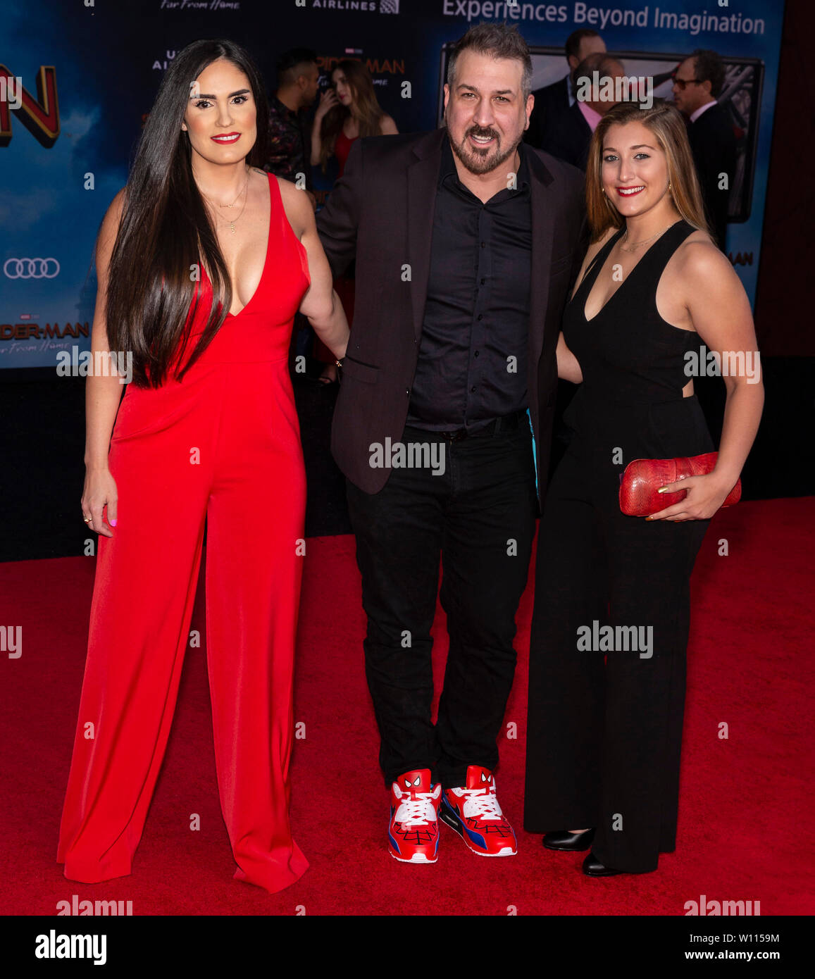 Los Angeles, CA - June 26, 2019: Kelly Baldwin, Joey Fatone and guest attend the premiere of Sony Pictures "Spider-Man Far From Home" held at TCL Chin Stock Photo