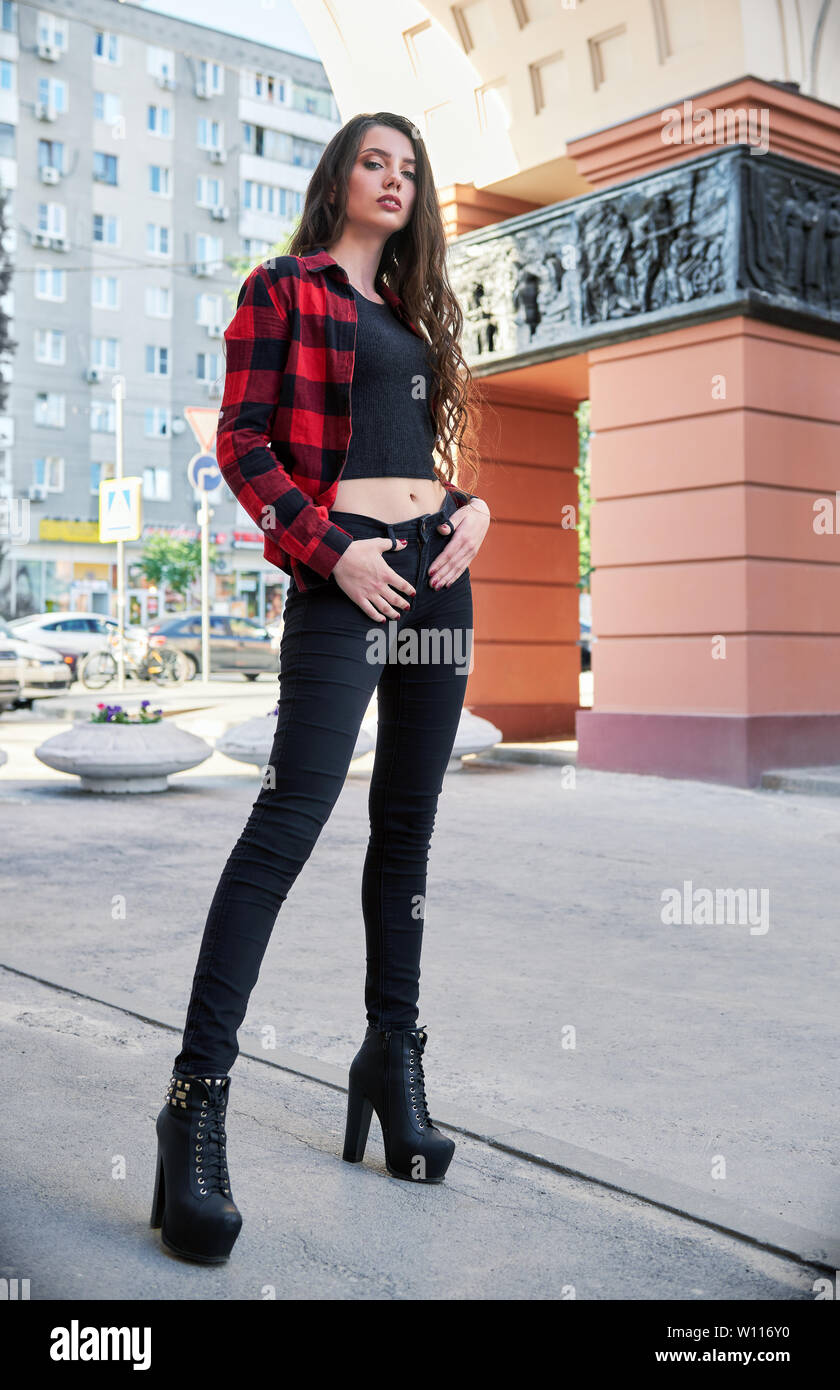 https://c8.alamy.com/comp/W116Y0/street-fashion-stylish-beautiful-young-girl-wearing-checkered-shirt-jeans-shoes-and-topic-W116Y0.jpg