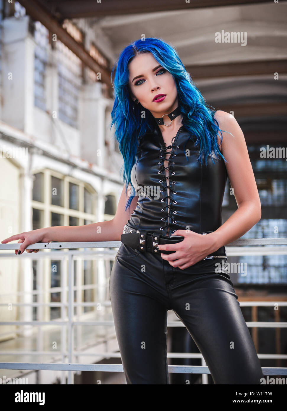 Cool Rock Girl Informal Model With Blue Hair Dressed In The Black Leather Pants And Vest Stock Photo Alamy