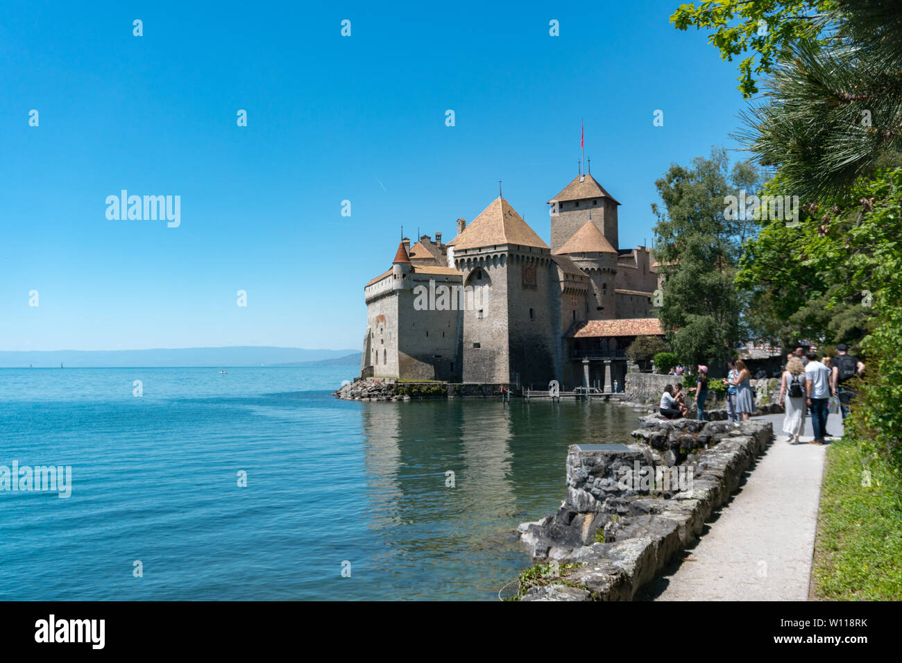 Montreux, VD / Switzerland - 31 May 2019: tourists visit the historic Chillon Castle on the shores of Lake Geneva Stock Photo