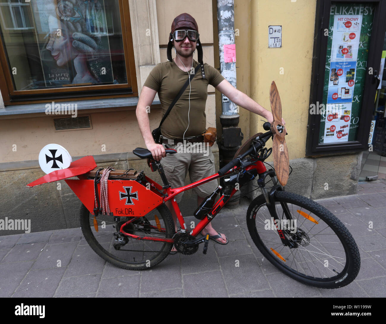 Krakow. Cracow. Poland. The fan of Red Baron Richthofen with his bike made up like red Fokker Dr.1. Stock Photo