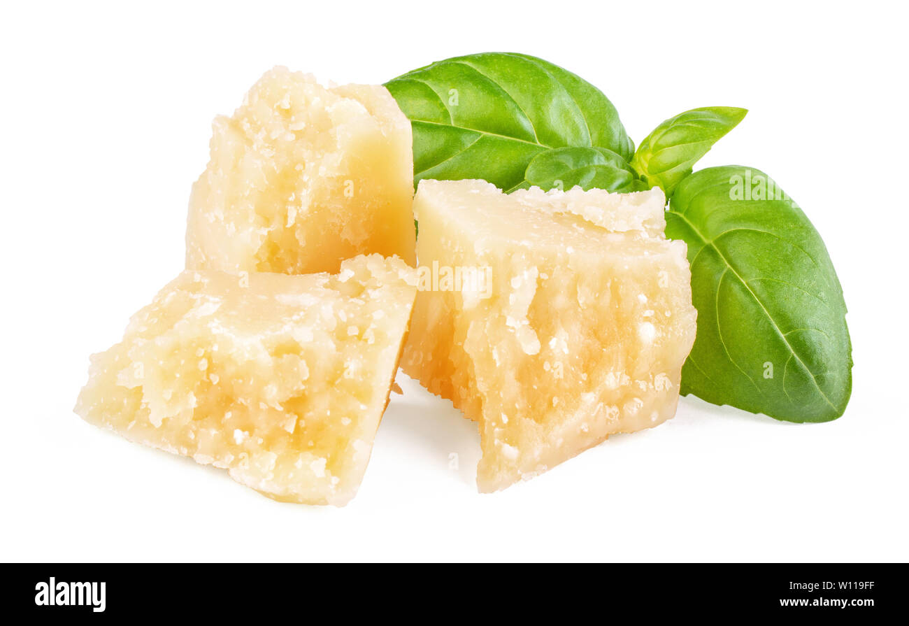 Three slices of permesan reggiano and basil bush isolated on white background, macro shooting, front view Stock Photo