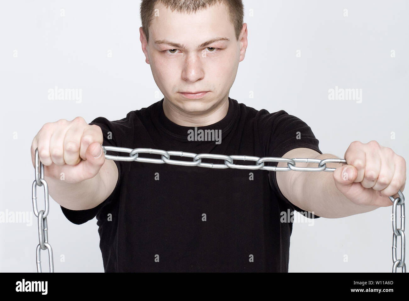 Man and shackles. The concept of freedom and slavery Stock Photo Alamy