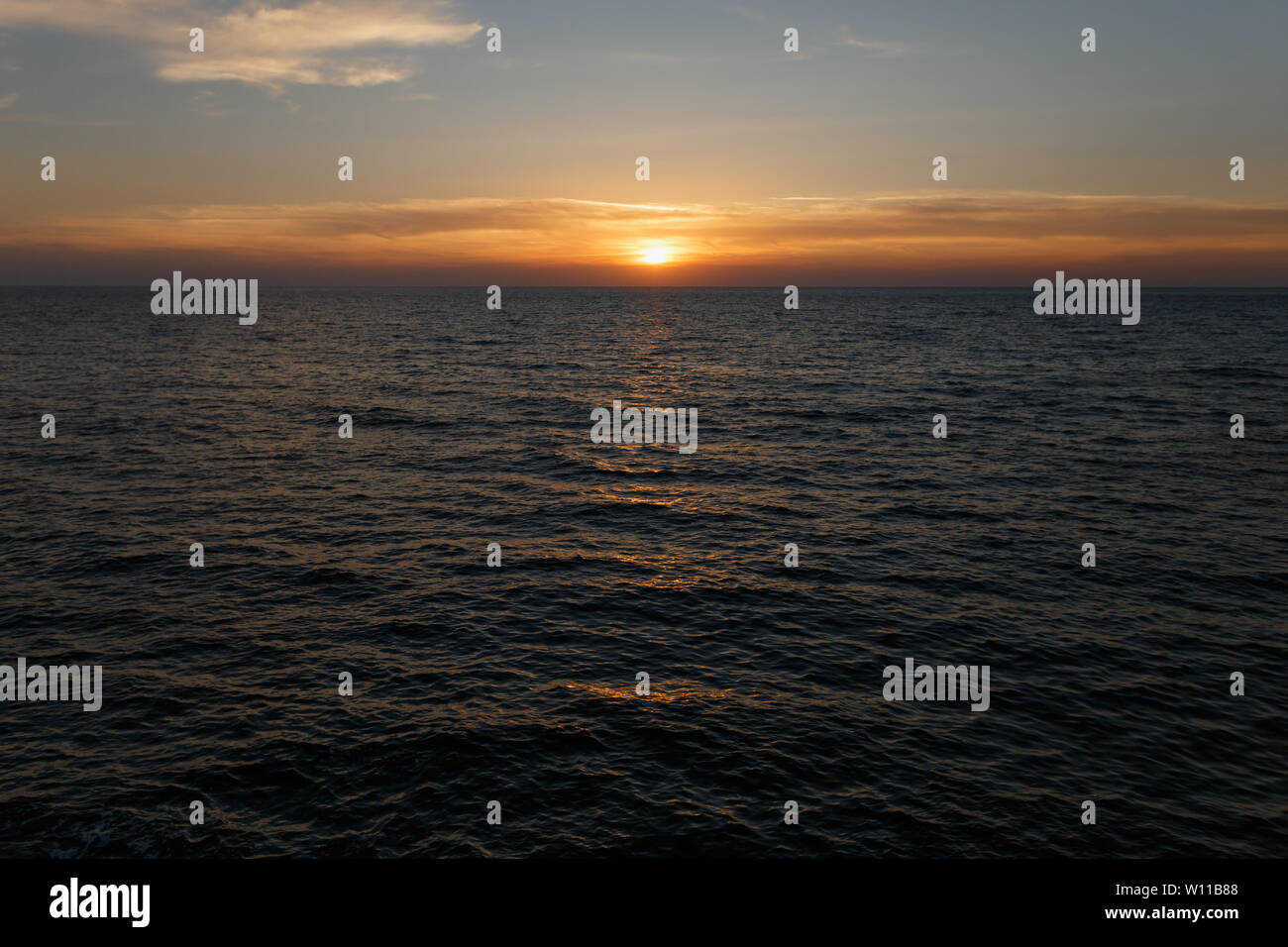 sunset and sunrise over the ocean Stock Photo - Alamy