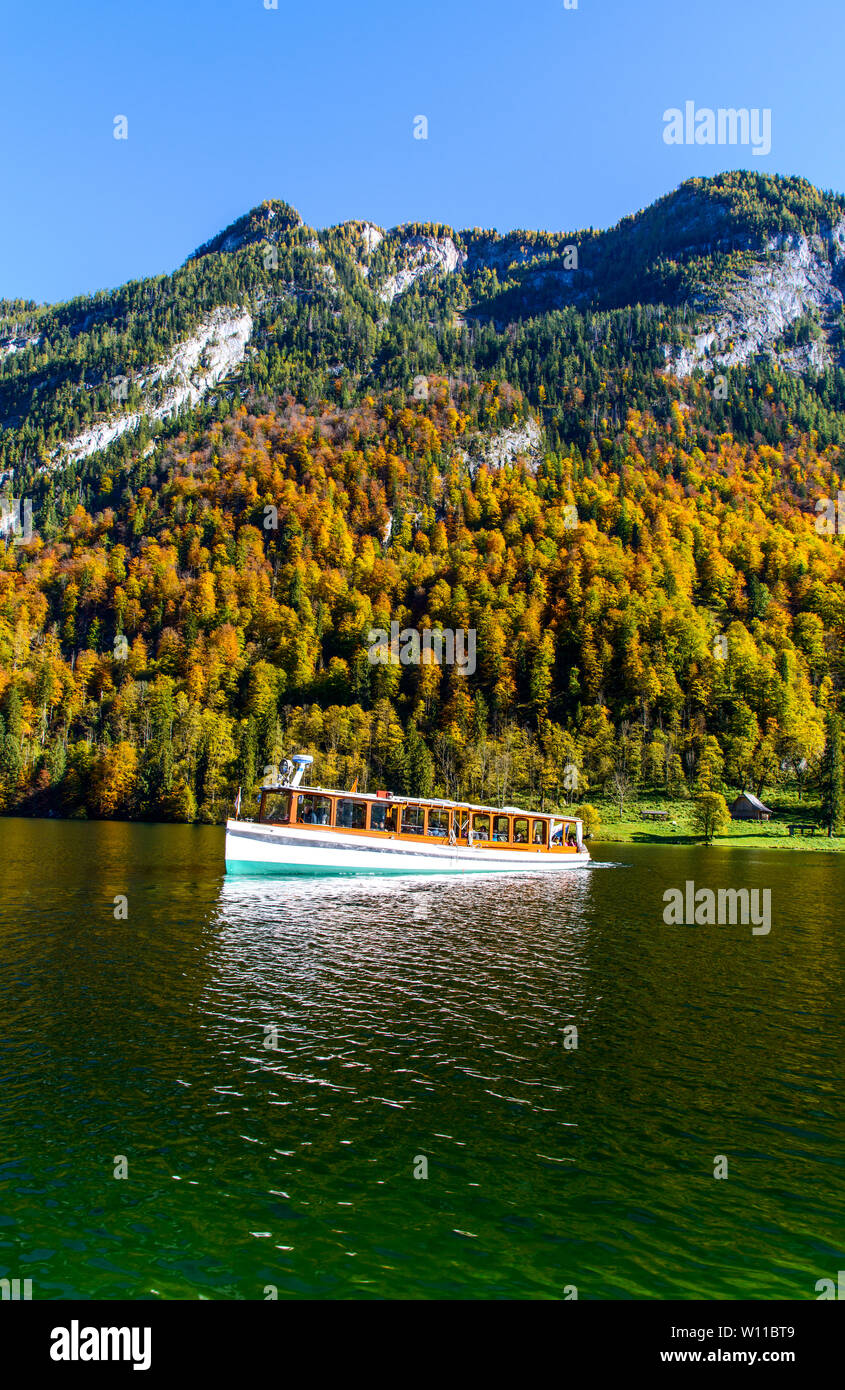 Boat ship on beautiful Königssee (Konigssee, Königsee, Konigssee, Koenigssee, Koenigsee,) lake in autumn. Berchtesgaden National Park, Bayern (Bavaria Stock Photo