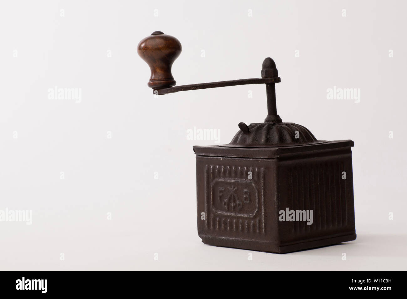 Pepper grinder, Vintage brass pepper mill isolated on white background