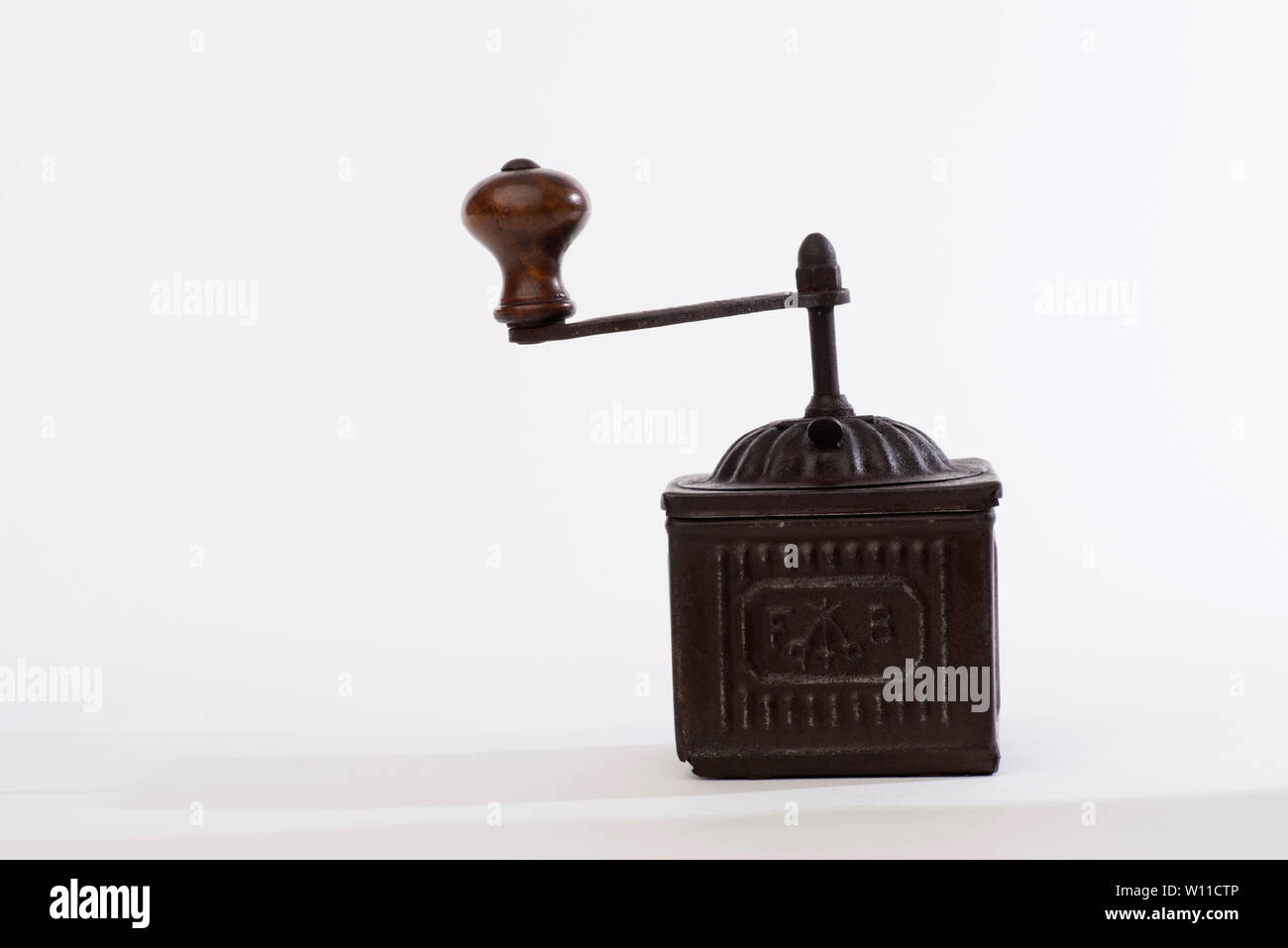 Pepper grinder, Vintage brass pepper mill isolated on white background