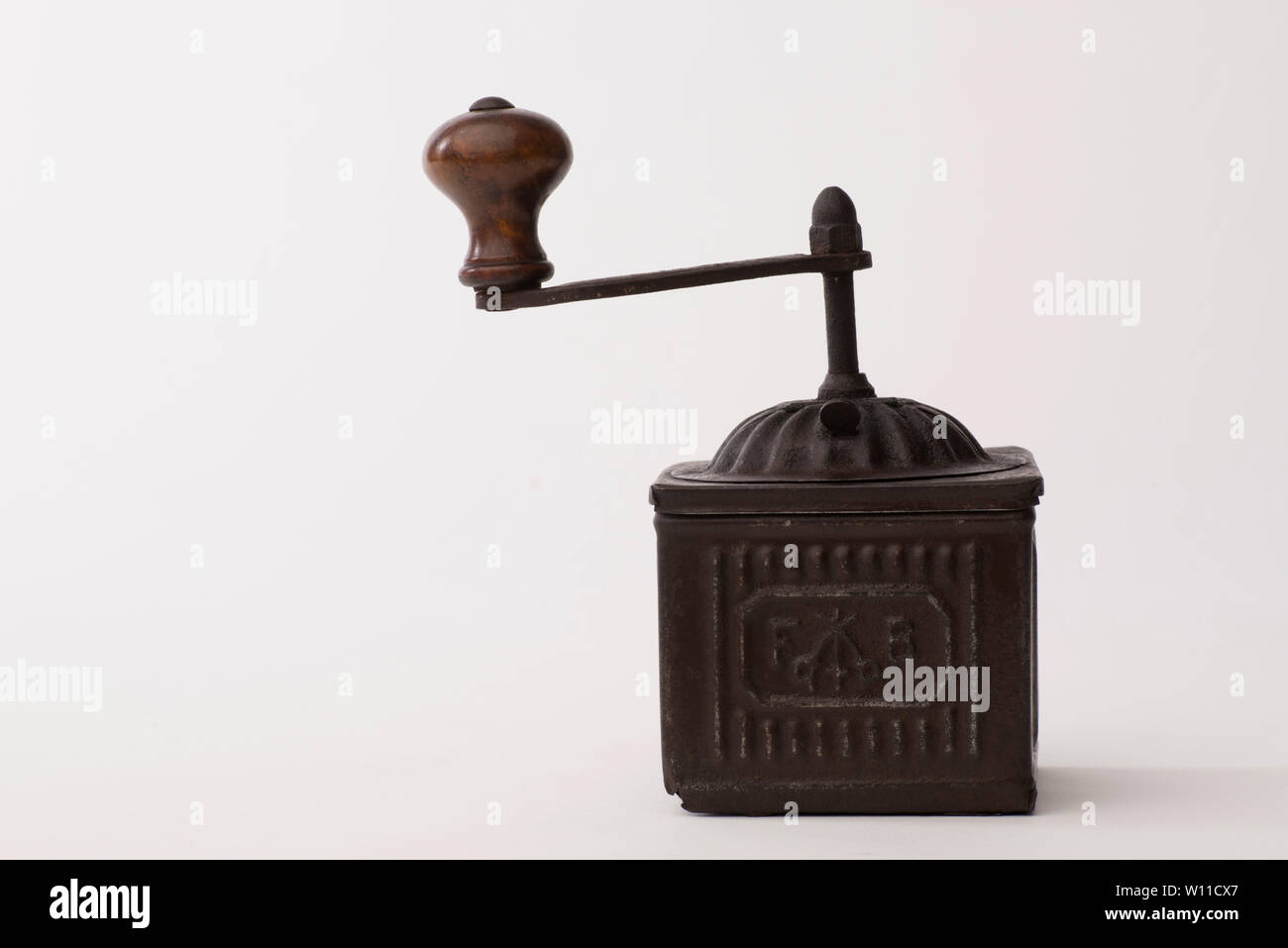 Pepper grinder, Vintage brass pepper mill isolated on white background