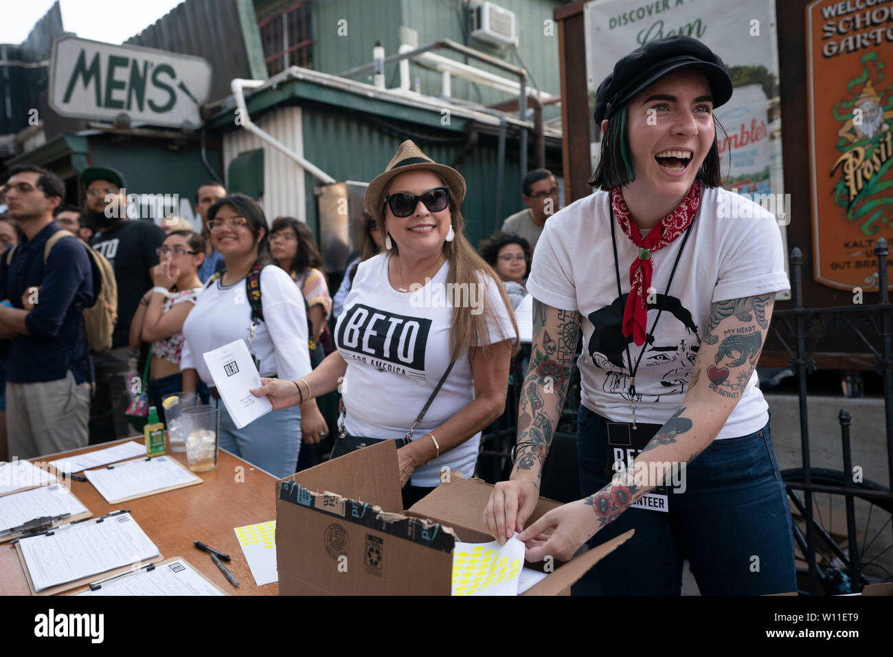 Enthusiastic young Beto O'Rourke supporters check in attendees at a campaign rally for the Democratic contender for the presidential nomination during an event at Scholz Garten in downtown Austin, Texas USA. Stock Photo