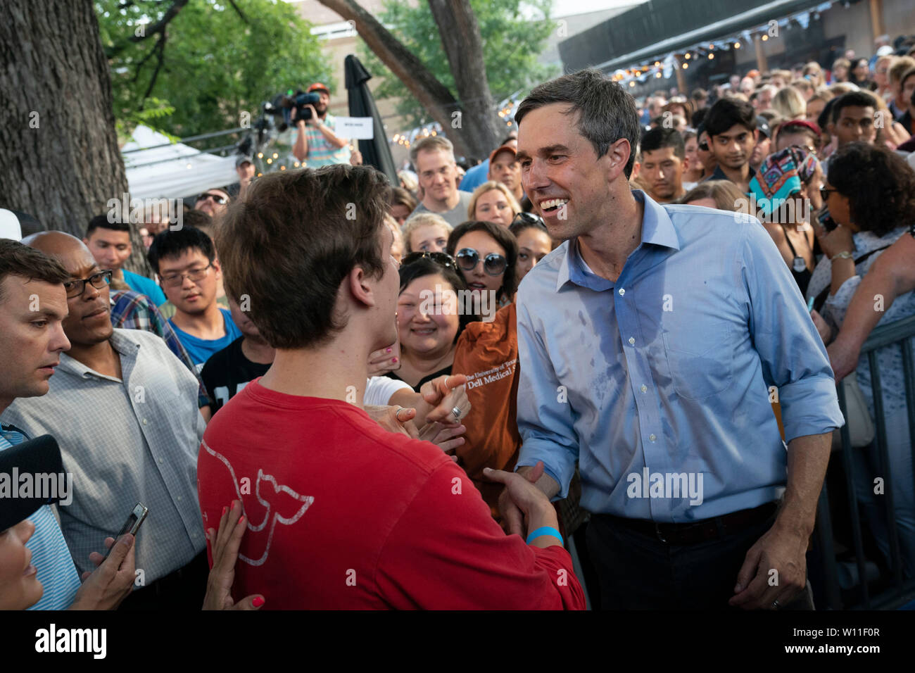 U.S. Democratic presidential primary candidate Beto O'Rourke works up a sweat while greeting some of the 300 supporters attending a campaign rally at Scholtz Garten in downtown Austin, Texas USA. Stock Photo