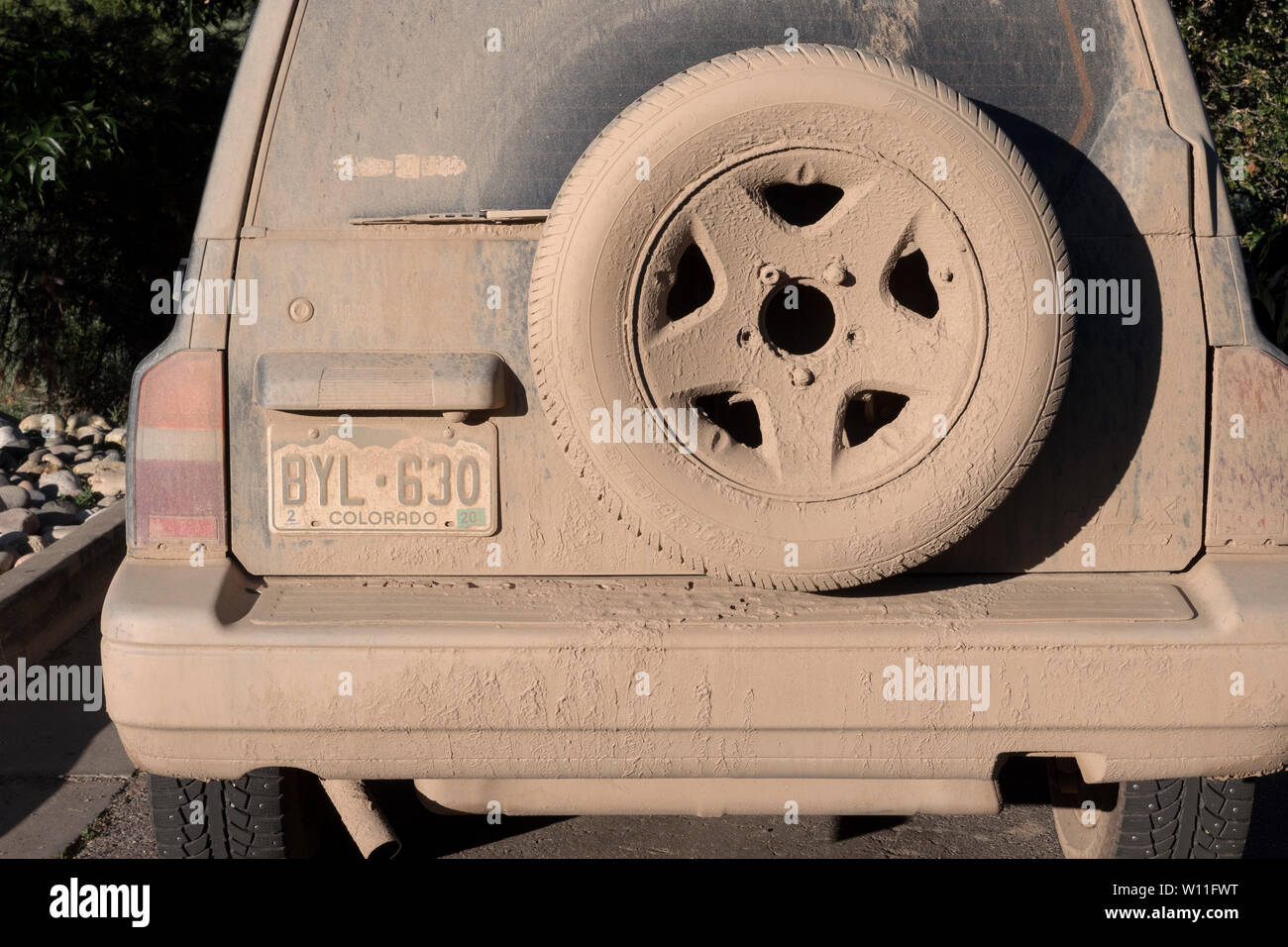 Rear of a 4x4 covered with mub in Colorado USA Stock Photo