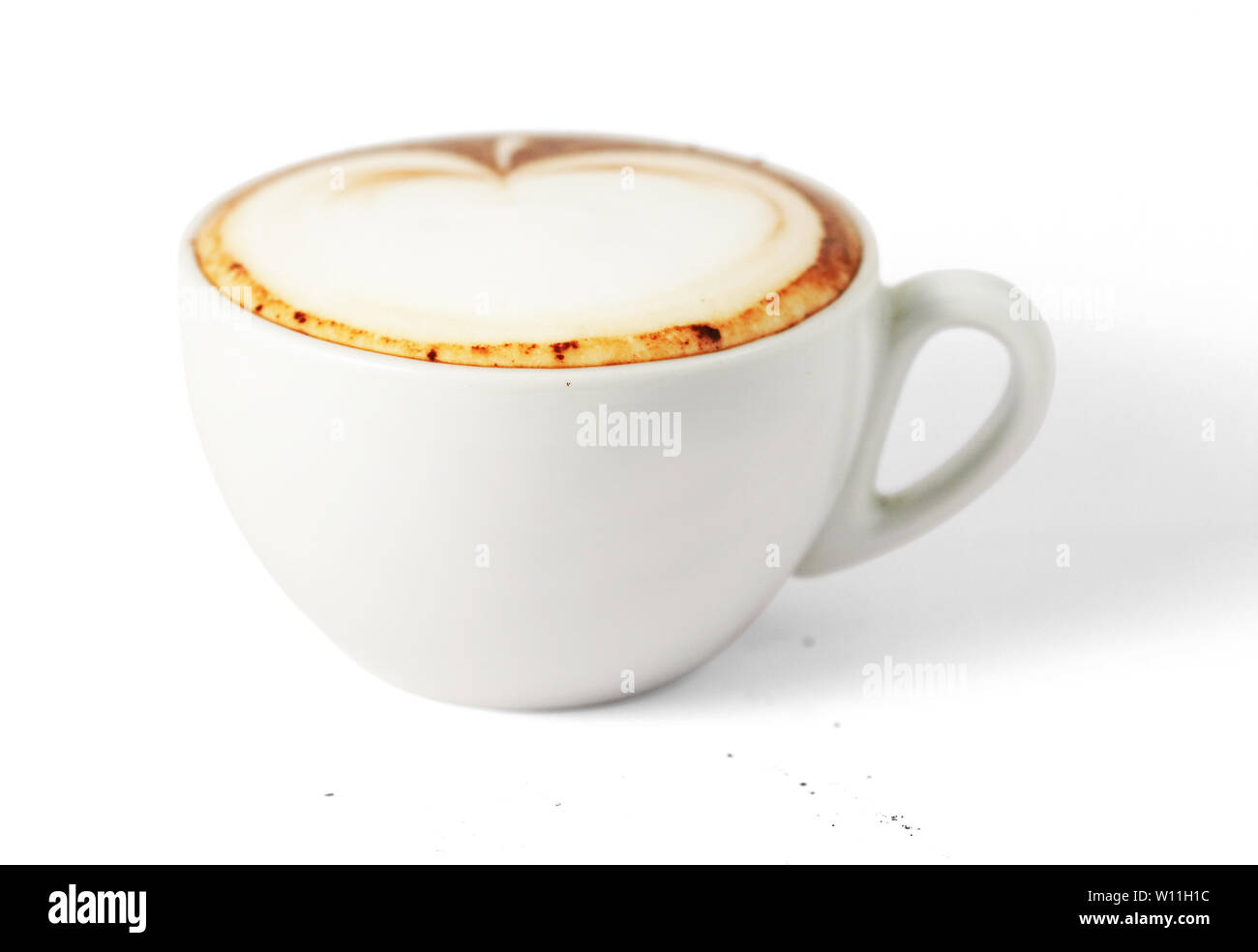 cappuccino cup with drawing on scum (with clipping path for easy ...