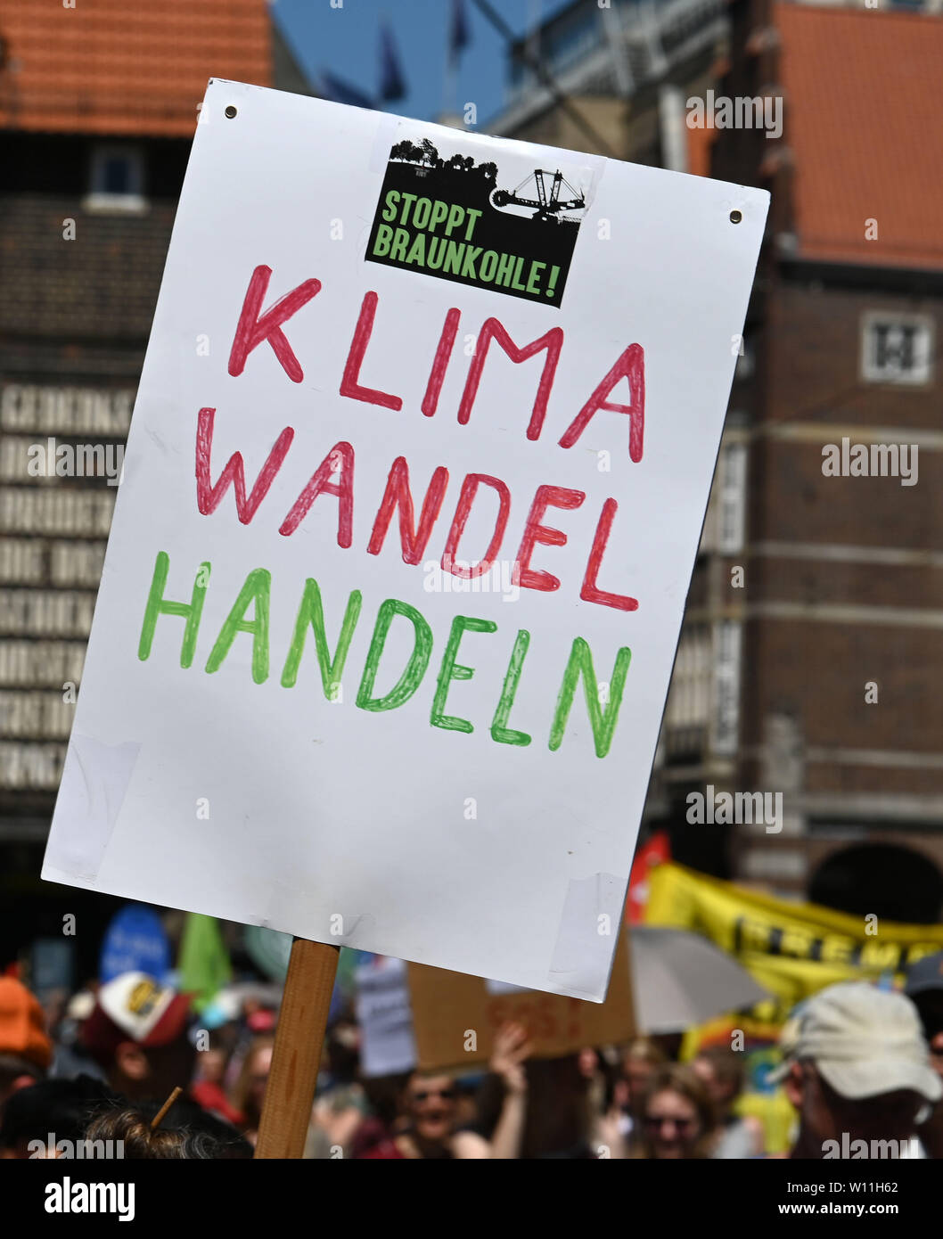 Bremen, Germany. 29th June, 2019. 'Climate Change Action' is on the screen of one of the participants at the major demonstration for climate protection. Under the title 'Actions Instead of Waiting - Climate Protection Now', environmental organisations are taking to the streets together with movements such as Fridays for Future, Parents for Future and Extinction Rebellion for Climate Protection. Credit: Carmen Jaspersen/dpa/Alamy Live News Stock Photo