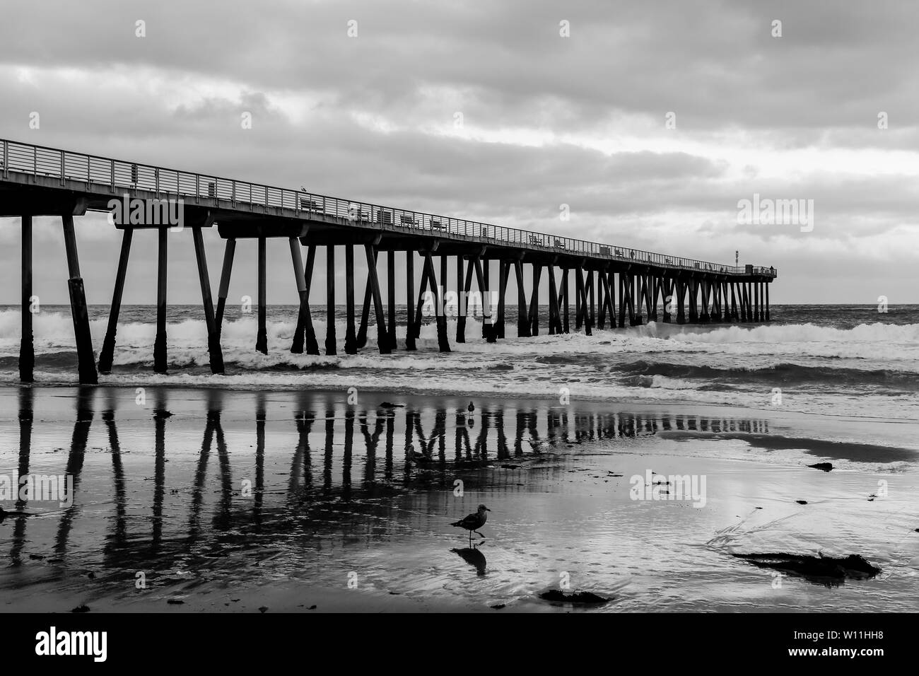 Hermosa Beach Pier (Los Angeles, USA) Reflection in monochrome Stock Photo