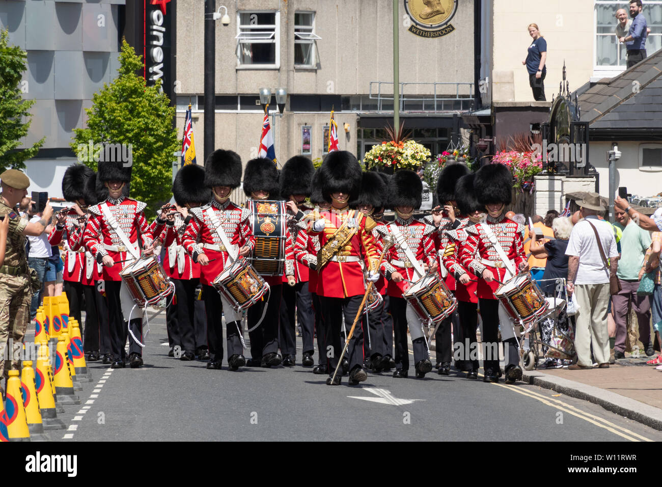 The Grenadier Guards parade around Aldershot town in Hampshire, UK, in