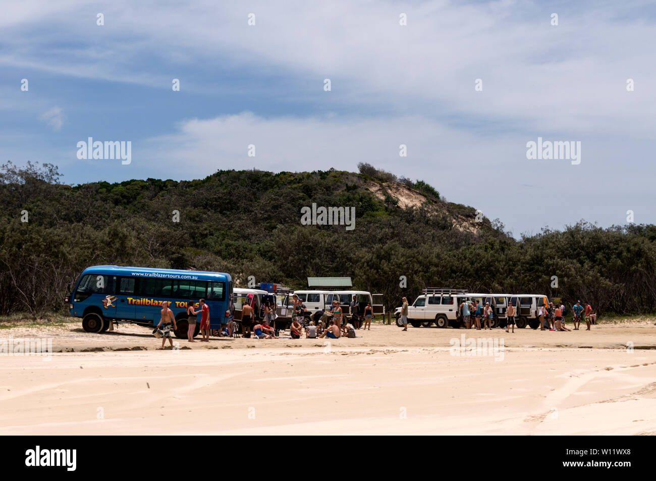 A party of young travellers taking a break close to the 75 mile long Sandy Highway on Fraser Island, Queensland, Australia  Fraser Island is a World H Stock Photo
