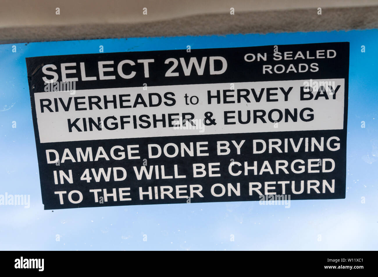 A warning sign attached to the windscreen of a hired 2WD vehicle on Fraser Island off Queensland, Australia  Fraser Island is a World Heritage site an Stock Photo