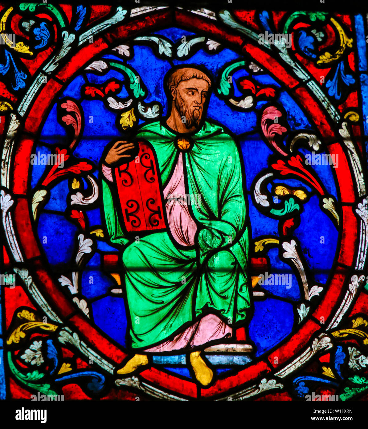 Stained Glass in the Cathedral of Notre Dame, Paris, France, depicting Moses carrying the Stone Tablets with the Ten Commandments Stock Photo
