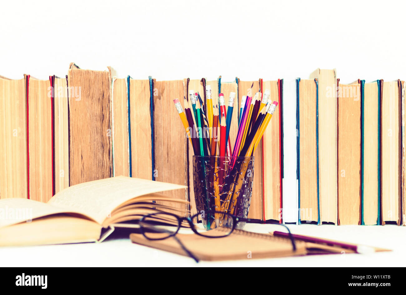 Open textbook, notebook, stack of books education back to school ...