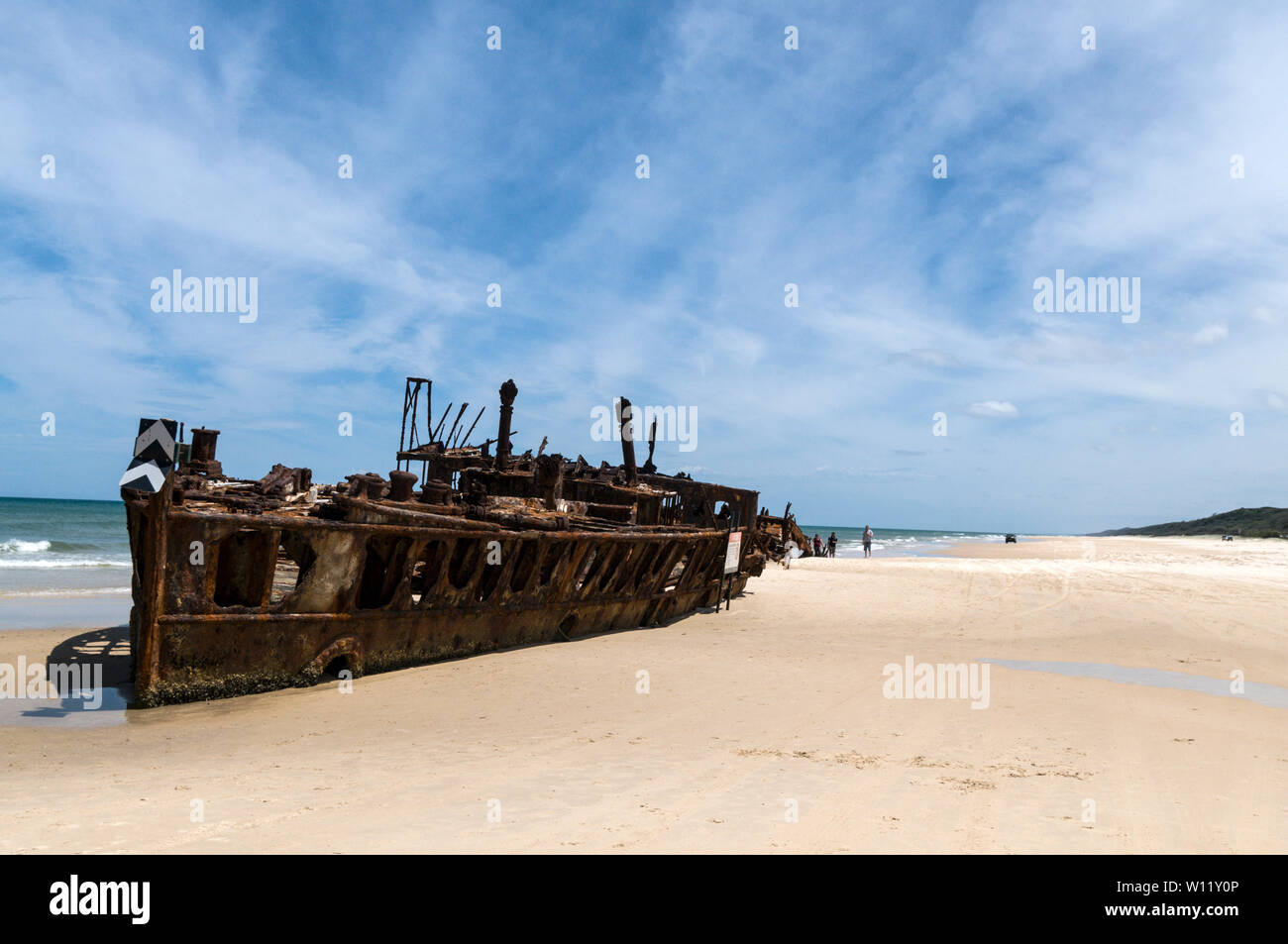 The rusted shipwreck of a New Zeland hospital ship, the SS Maheno, is a landmark on the 75-mile beach facing the Coral Sea on Fraser Island, Queensland Stock Photo