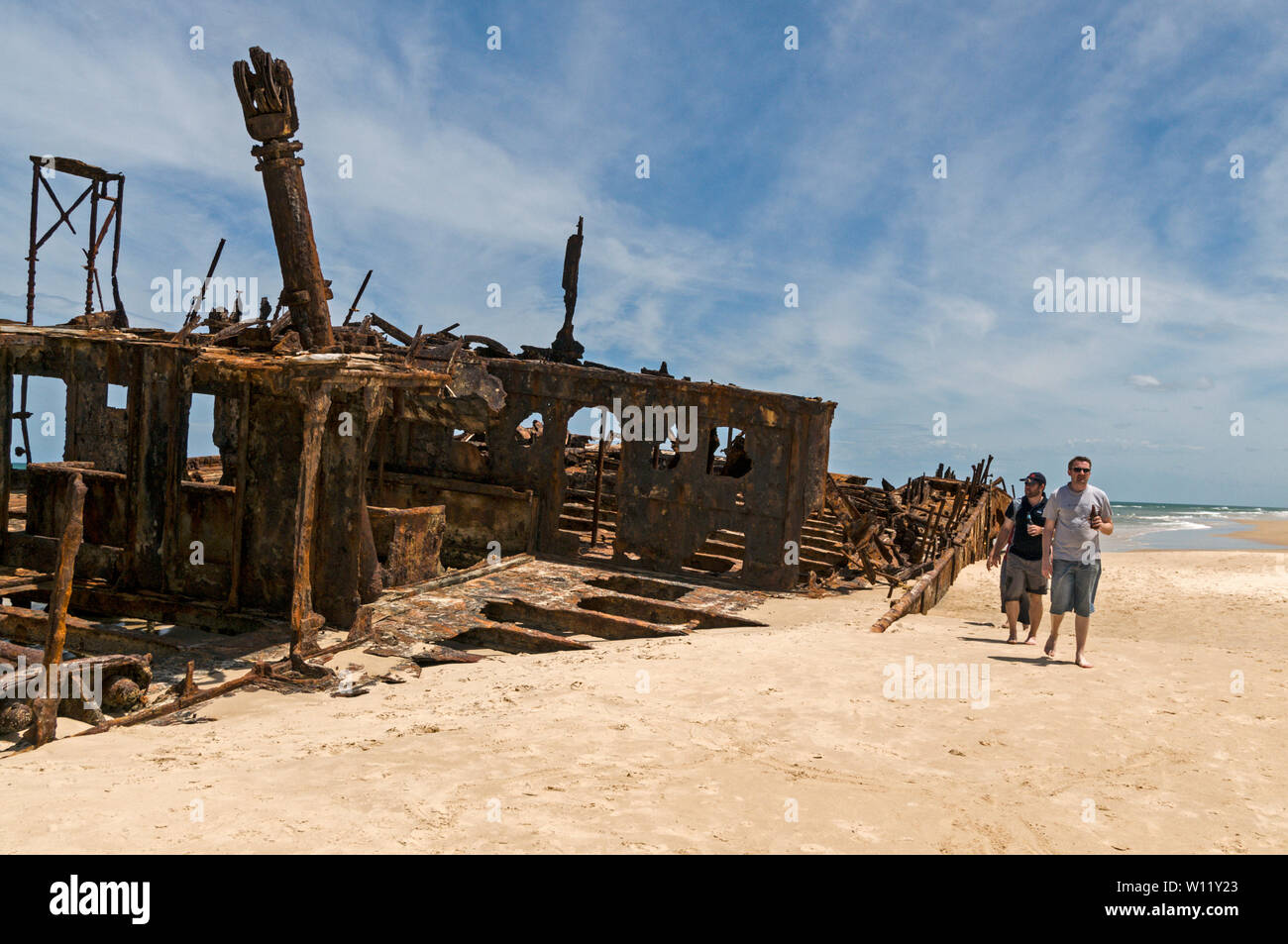 The rusted shipwreck of a New Zeland hospital ship, the SS Maheno, is a landmark on the 75-mile beach facing the Coral Sea on Fraser Island, Queensland Stock Photo