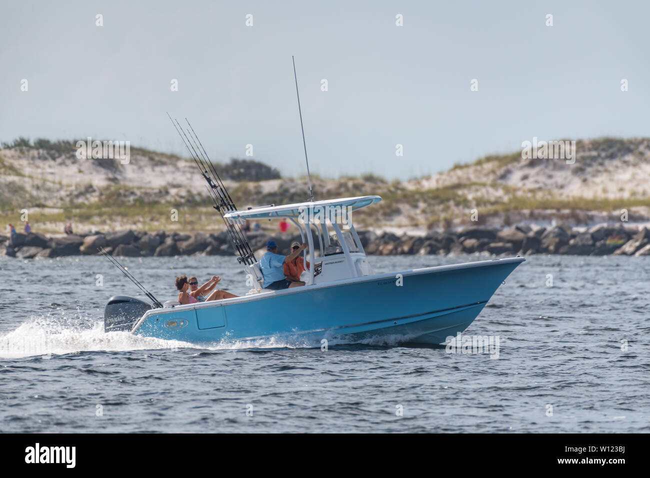 Panama City, Florida, USA 06/28/2019. Boat traveling through the pass, jetties, St. Andrews State Park for a day of fishing in the gulf of mexico Stock Photo