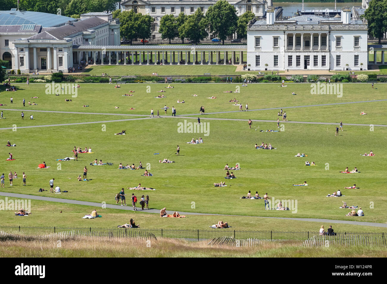 People enjoying hot and sunny day in Greenwich Park, London, England, United Kingdom, UK Stock Photo