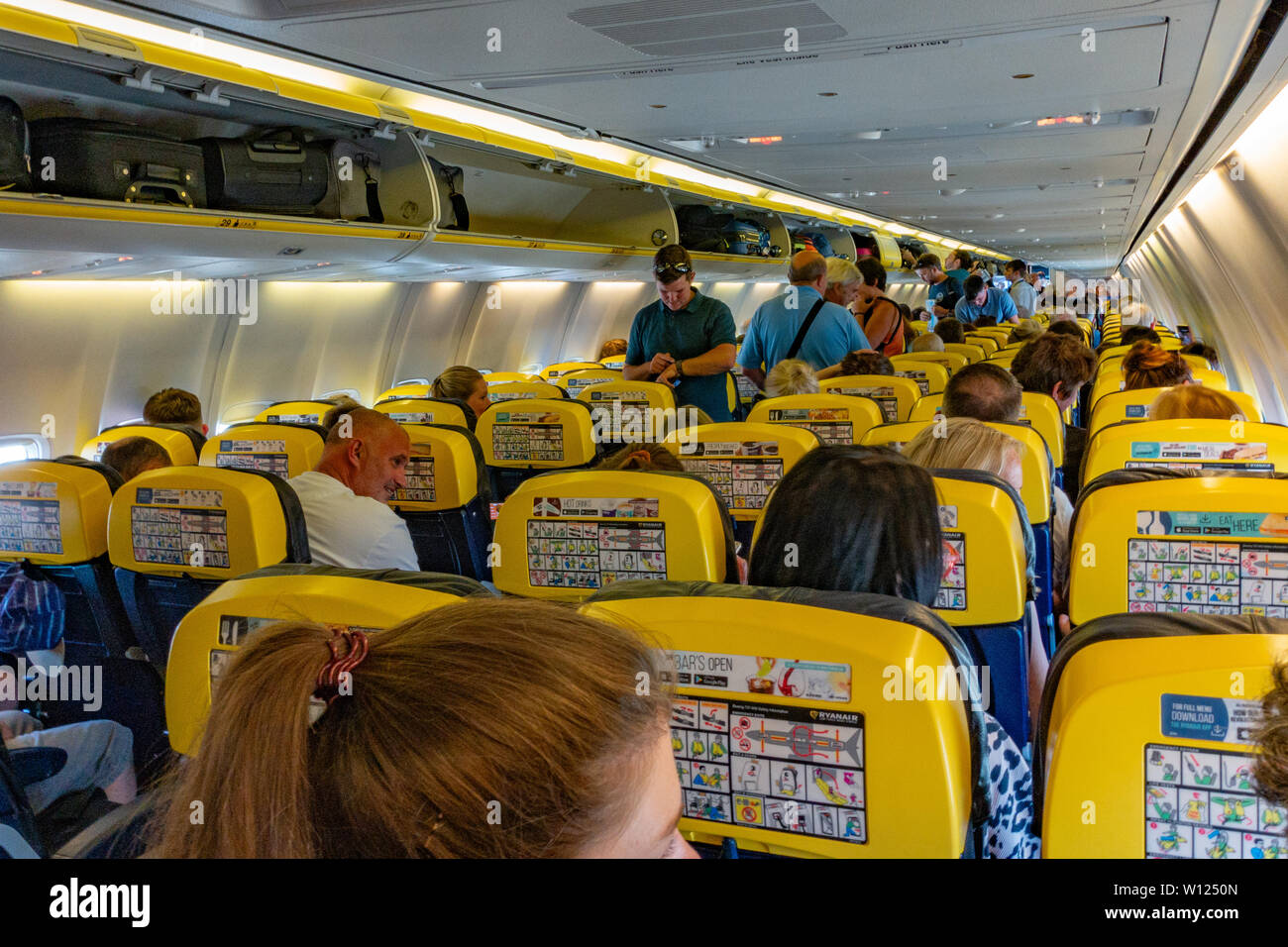 Passengers Inside The Cabin Of A Ryanair Boeing 737 Jet Plane Stock 
