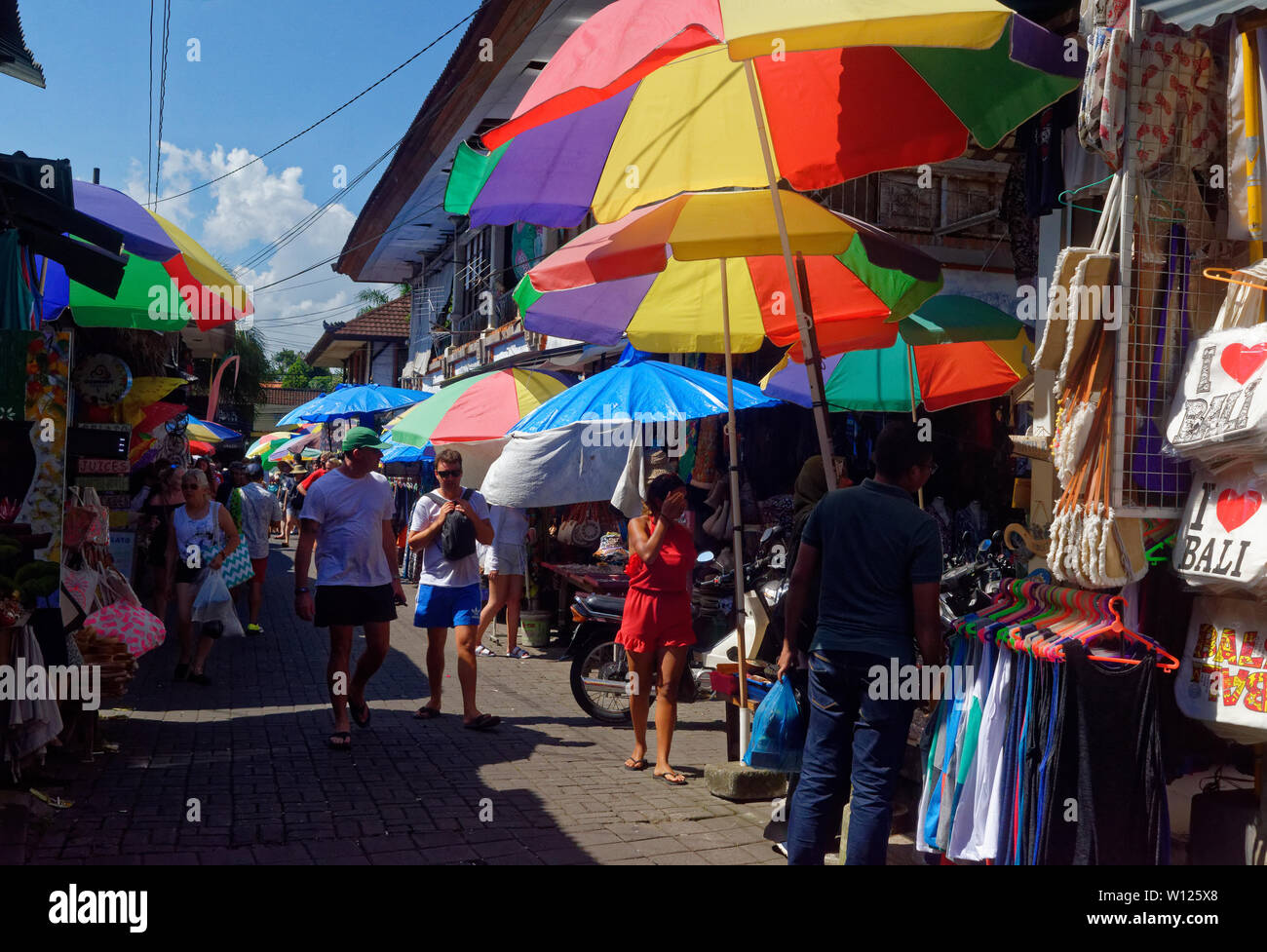 Tourists shopping in Ubud old craft market, Bali, Indonesia Stock Photo
