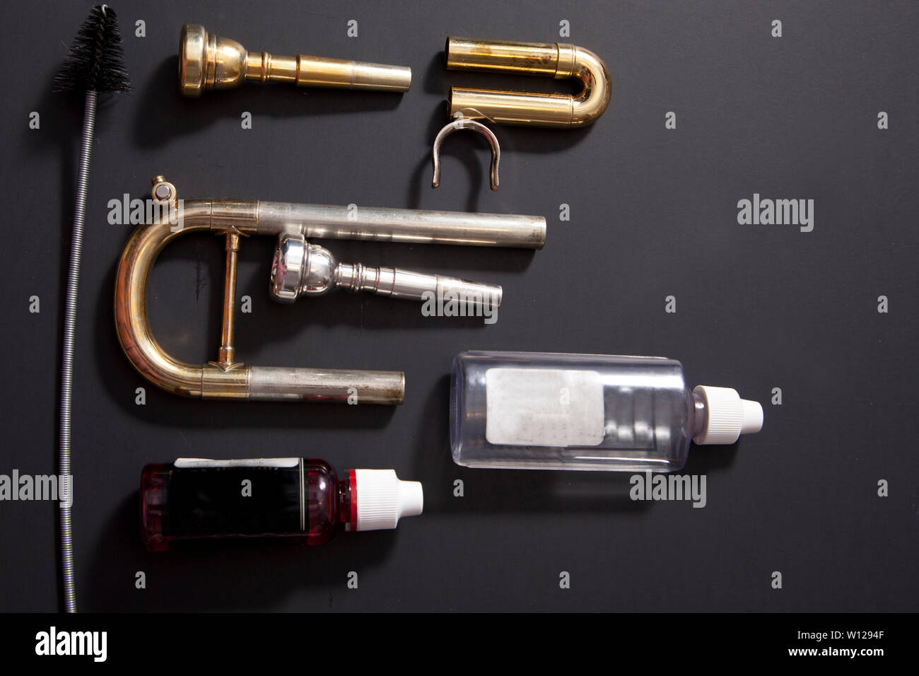 Lay flat trumpet valves, tubing and valve oil cleaners Stock Photo Alamy