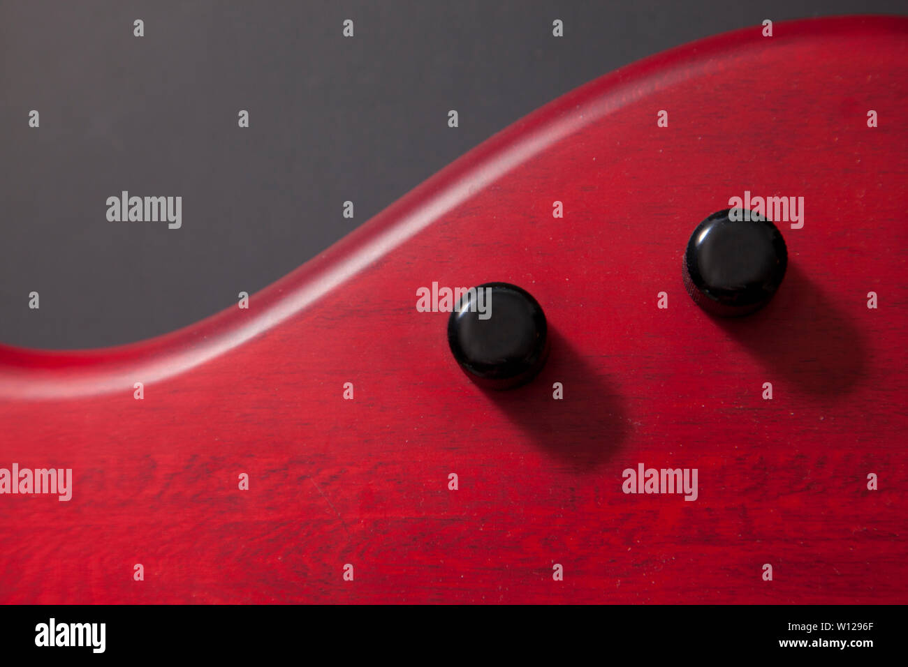 two pots on a red bass guitar with black copy space Stock Photo Alamy