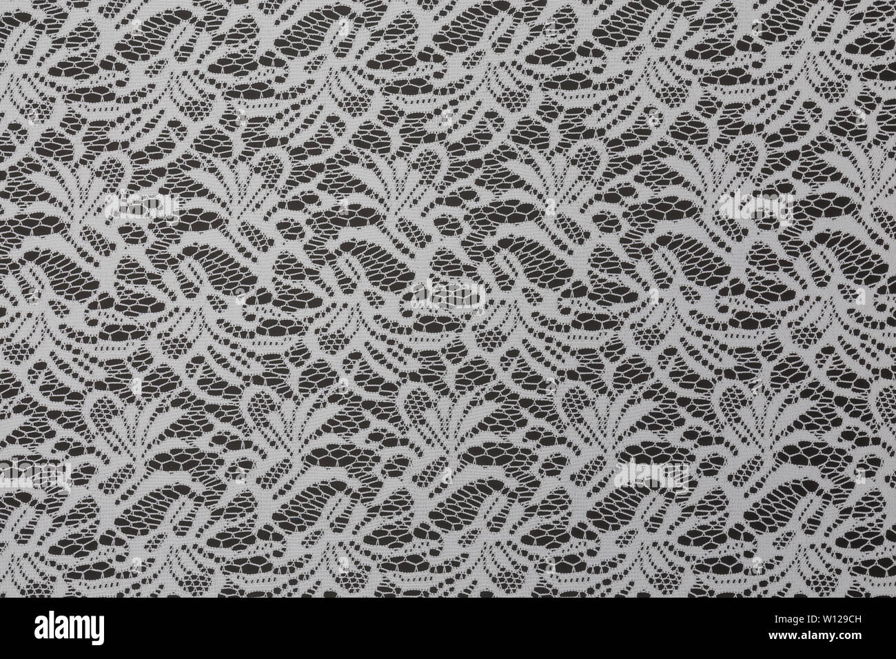 Creative black fabric with white floral pattern and textile texture background Stock Photo