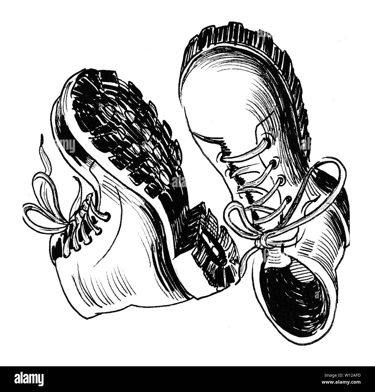 Pair of a military shoes. Ink black and white illustration Stock Photo