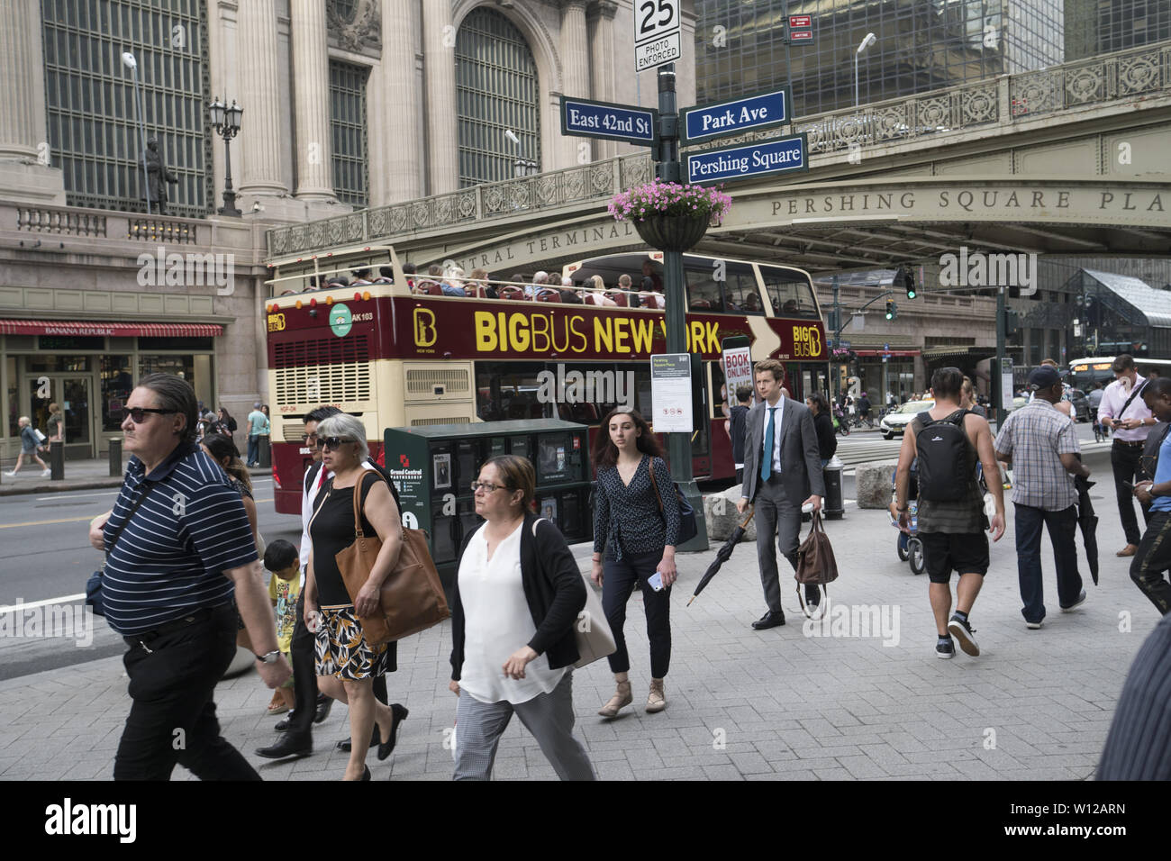 People walk west on 42nd Street across from Grand Central Terminal in Manhattan, NYC. Stock Photo