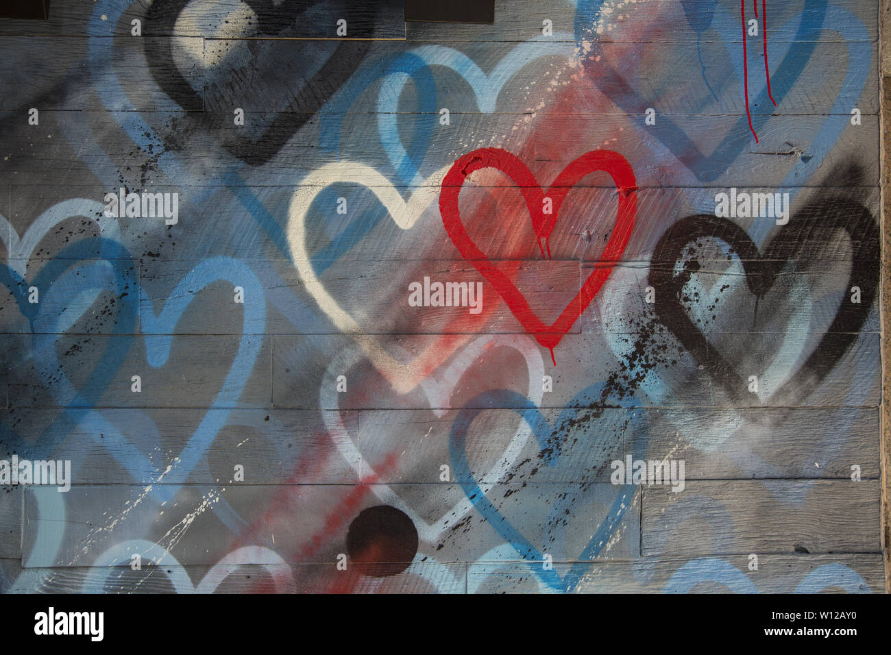 Painted hearts on a wall in New York City. Stock Photo
