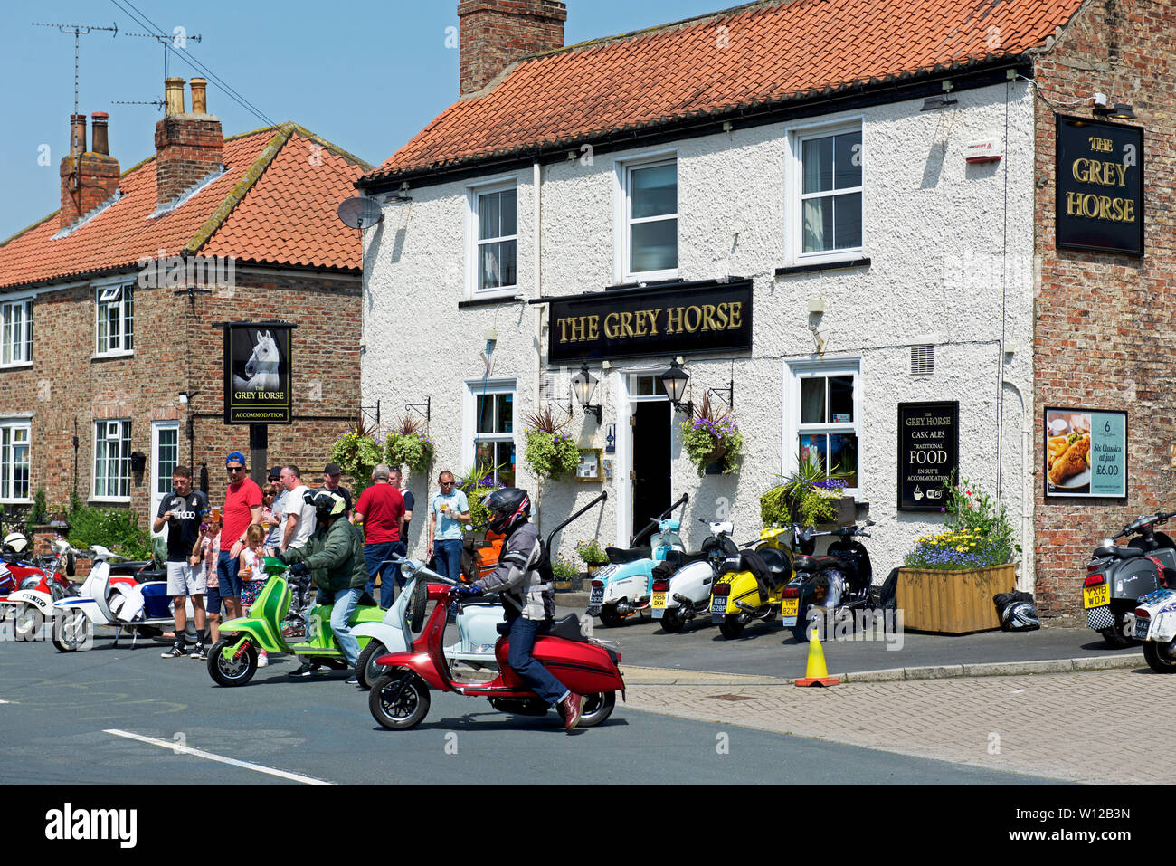 Scooter riders hi-res stock photography and images - Alamy