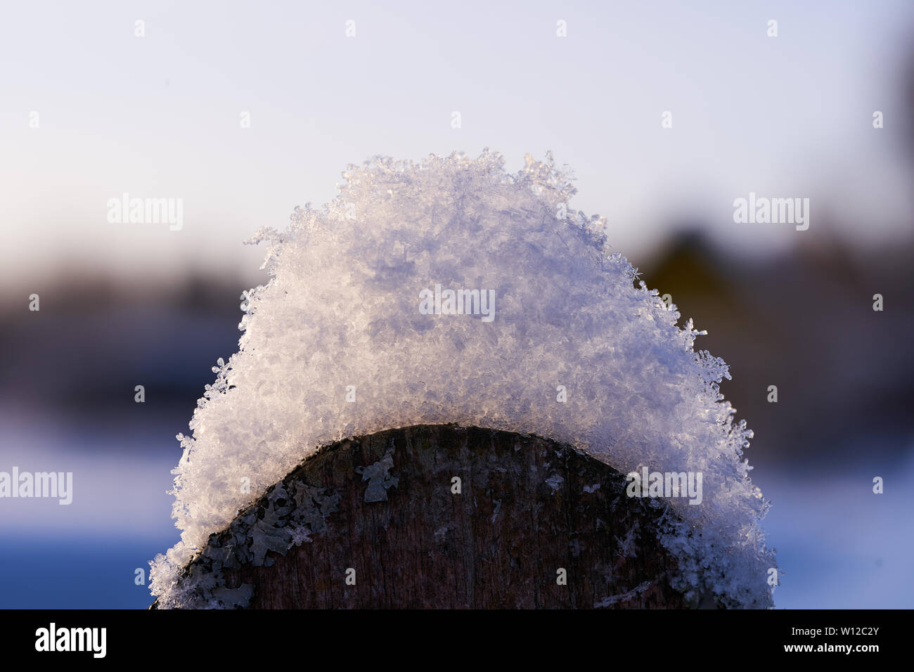 Snow on the elements of a wooden fence Stock Photo - Alamy