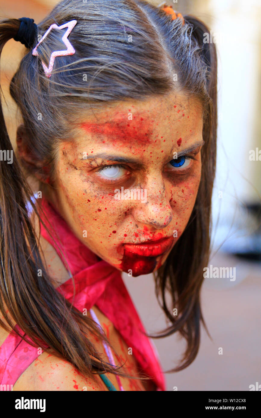Ferrara, Italy, 16/09/2017: Funny cosplay dressed as Zombie of walking dead movie series, photographed during a carnival Stock Photo