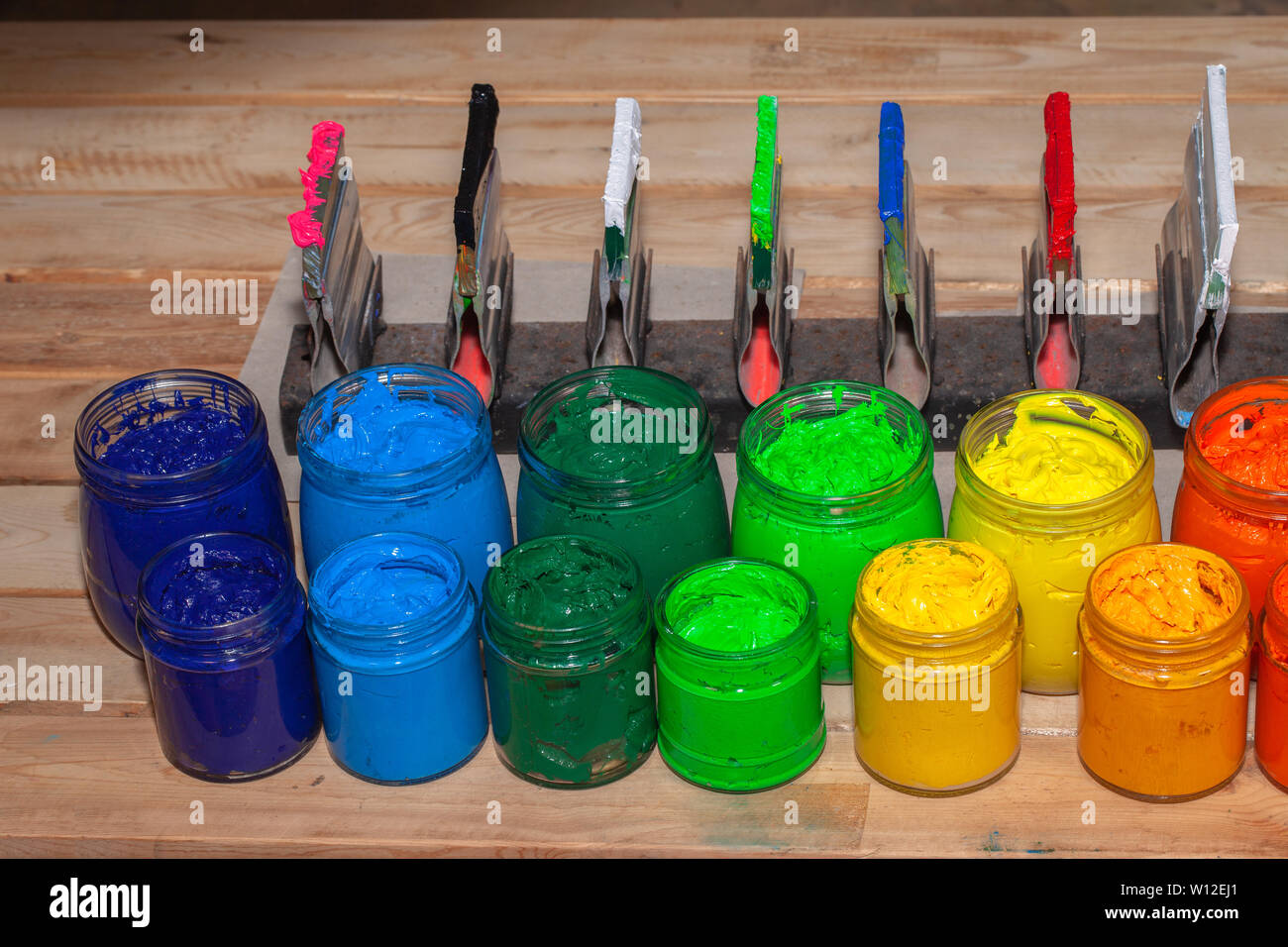 colorful plastisol ink in transparent bottles in screen printing tee shirt  factory store Stock Photo - Alamy