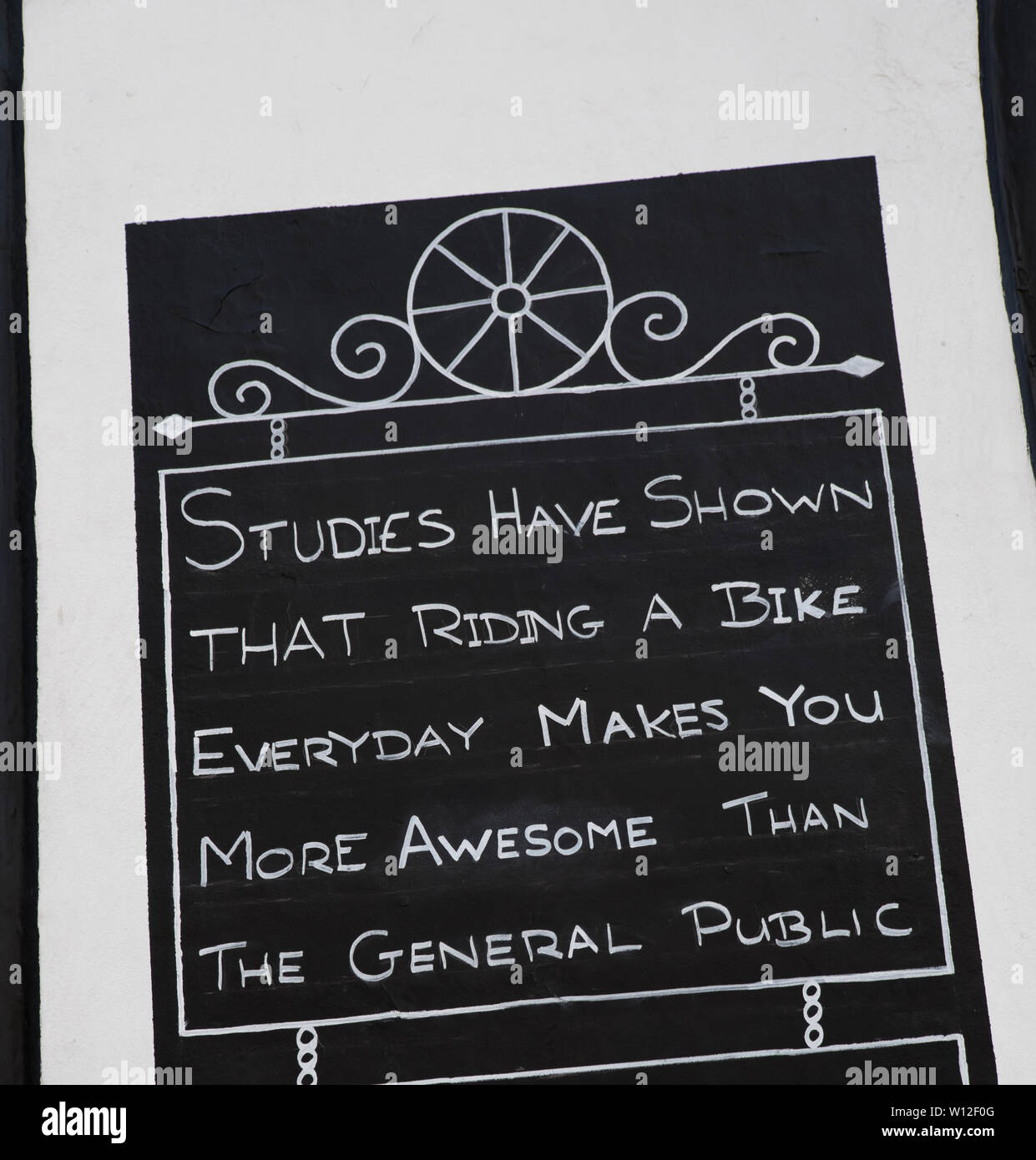 Bike riding benefits sign Stock Photo - Alamy