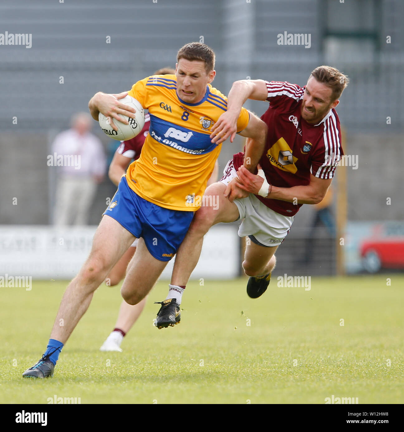 Westmeath, Ireland. 29th June 2019.  TEG Cusack Park, Mullingar, Westmeath, Ireland; GAA Gaelic Football round 3, Westmeath versus Clare; Gary Brennan (Clare) holds off a challenge from Kevin Maguire (Westmeath) Credit: Action Plus Sports Images/Alamy Live News Stock Photo