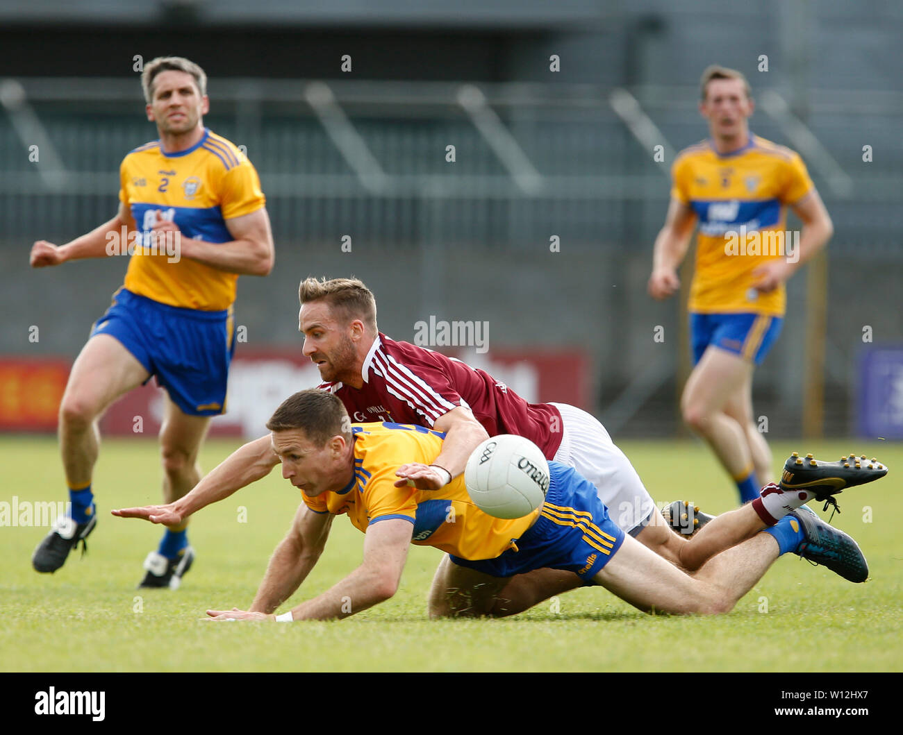 Westmeath, Ireland. 29th June 2019.  TEG Cusack Park, Mullingar, Westmeath, Ireland; GAA Gaelic Football round 3, Westmeath versus Clare; Kevin Maguire (Westmeath) and Gary Brennan (Clare) challenge for the ball Credit: Action Plus Sports Images/Alamy Live News Stock Photo