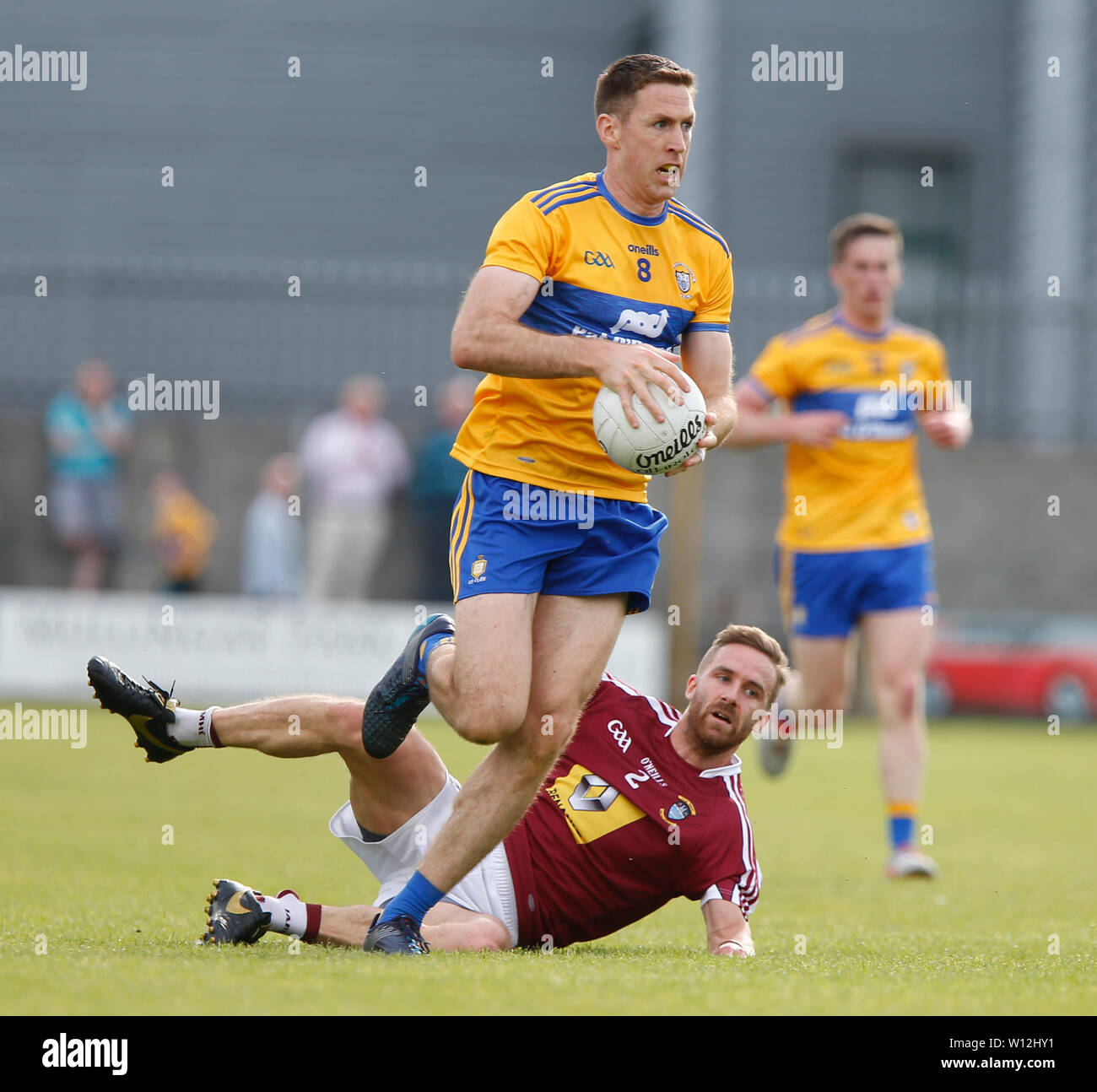 Westmeath, Ireland. 29th June 2019.  TEG Cusack Park, Mullingar, Westmeath, Ireland; GAA Gaelic Football round 3, Westmeath versus Clare; Gary Brennan (Clare) gets away from Kevin Maguire (Westmeath) Credit: Action Plus Sports Images/Alamy Live News Stock Photo