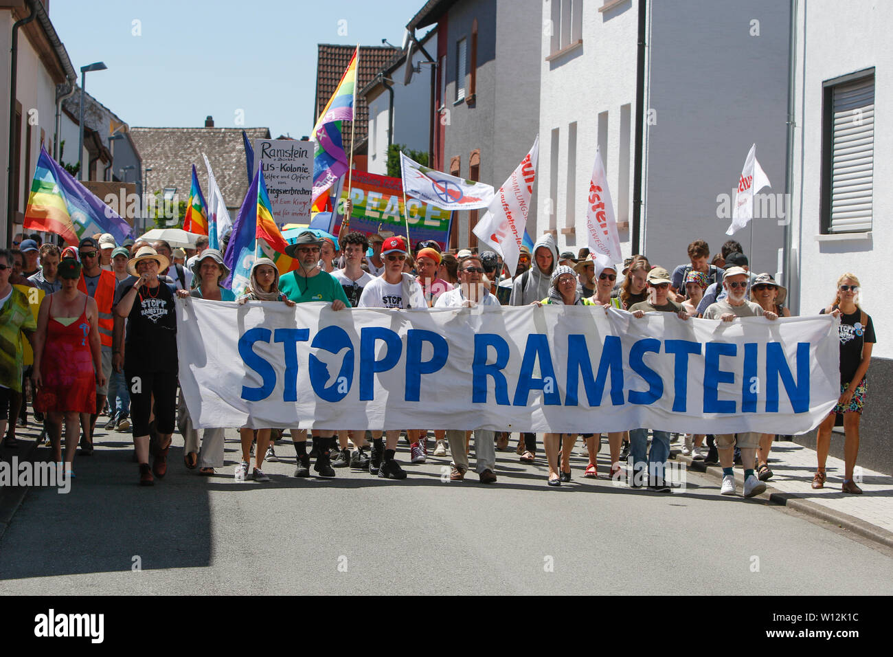 ramstein-germany-29th-june-2019-the-protesters-march-with-the-front-banner-reading-stopp-ramstein-through-ramsteina-few-thousand-peace-activists-from-the-stopp-air-base-ramstein-campaign-protested-outside-the-us-airbase-in-ramstein-the-protest-was-the-end-of-this-years-week-of-action-against-the-airbase-the-main-focus-of-this-years-events-was-on-the-alleged-involvement-of-the-airbase-in-the-drone-warfare-of-the-us-air-force-in-the-middle-east-and-africa-and-call-to-not-use-ramstein-for-a-future-war-with-iran-W12K1C.jpg
