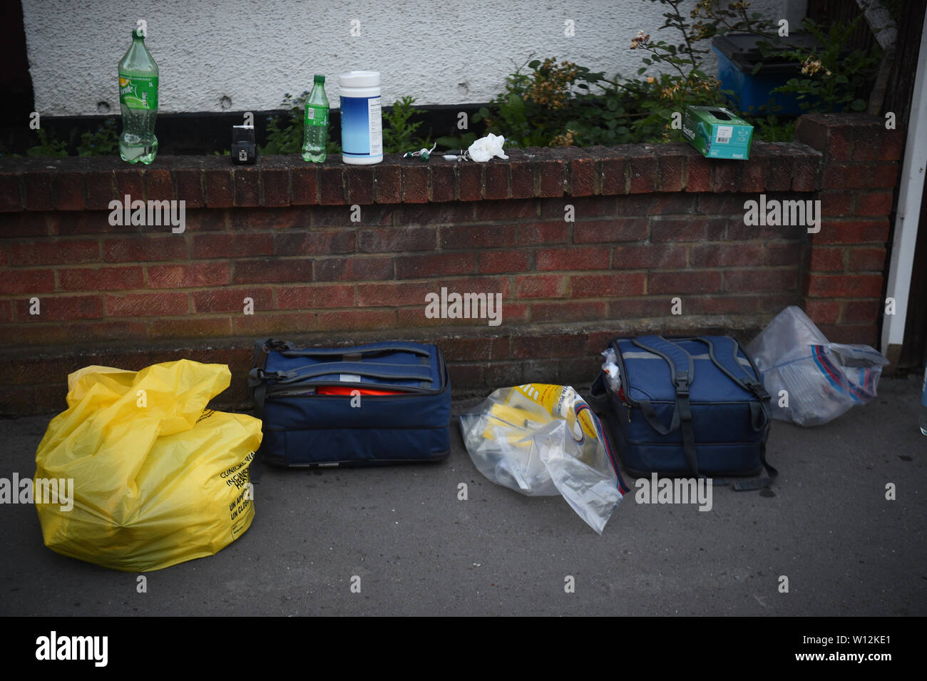 Forensic bags at the scene in Raymead Avenue, Thornton Heath, Croydon where a women who was around eight months pregnant has been stabbed to death and her baby is critically ill in hospital. Stock Photo