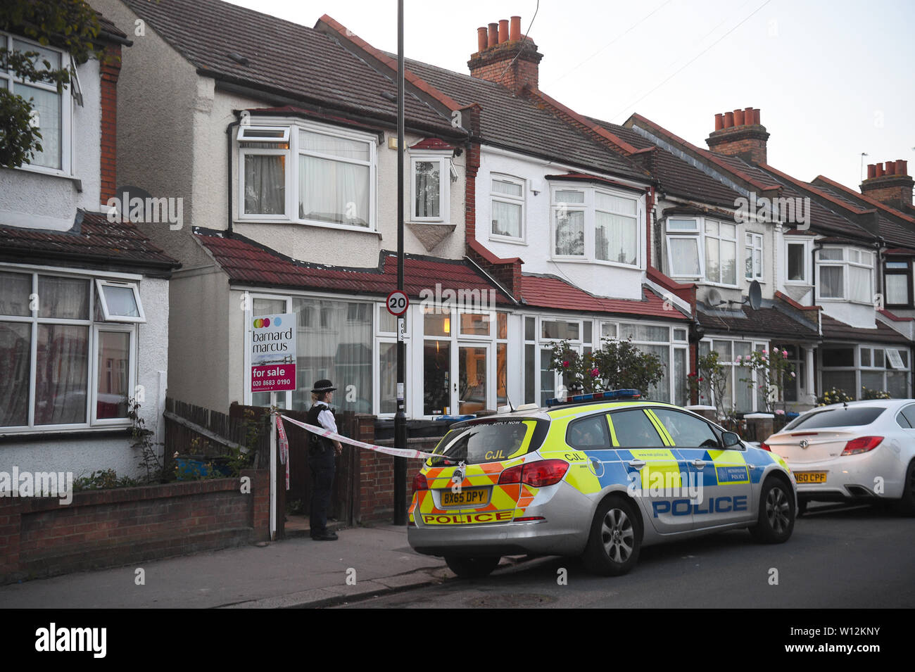 Police at the scene in Raymead Avenue, Thornton Heath, Croydon where a women who was around eight months pregnant has been stabbed to death and her baby is critically ill in hospital. Stock Photo